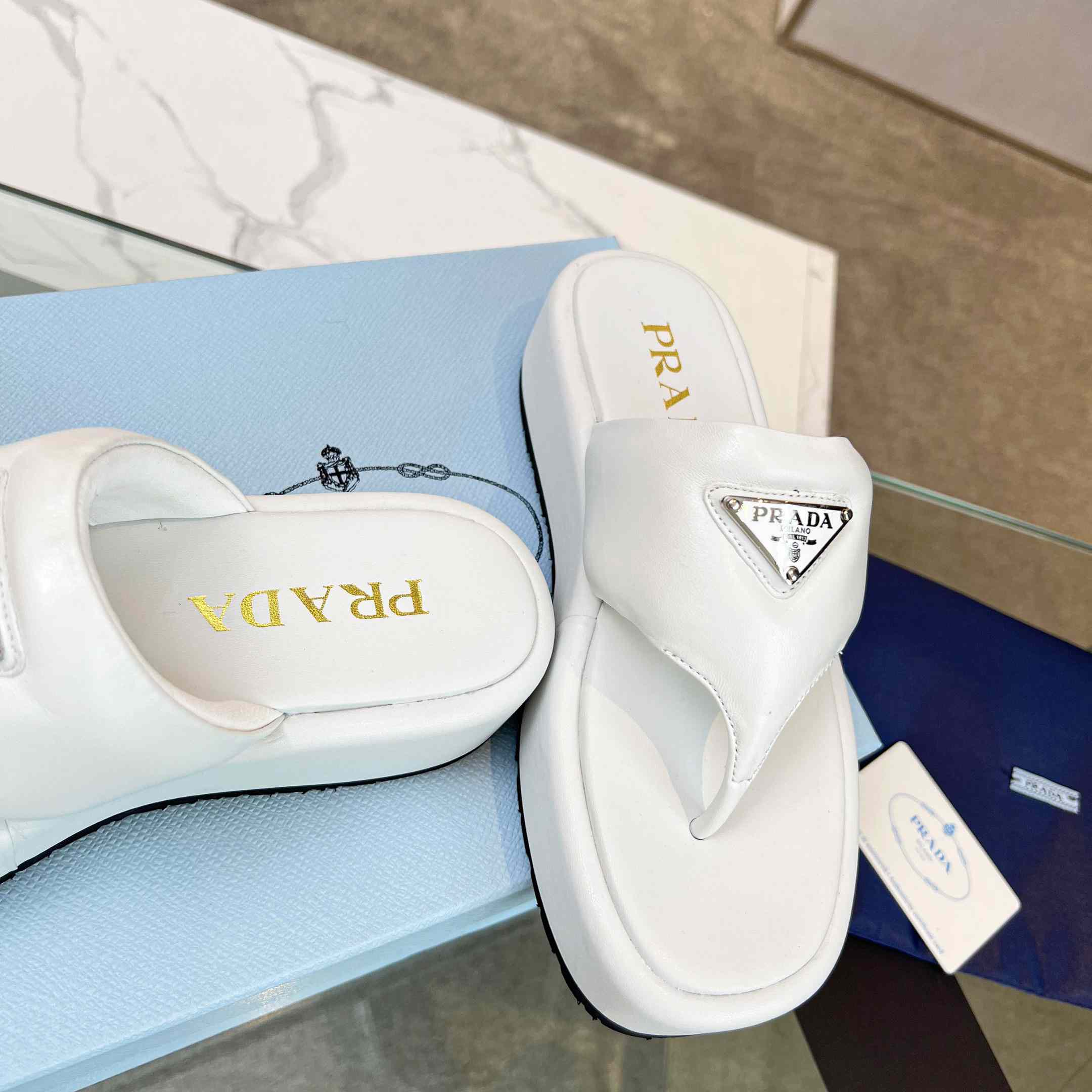 Prada Soft Padded Nappa Leather Thong Wedge Sandals - FashionPlug