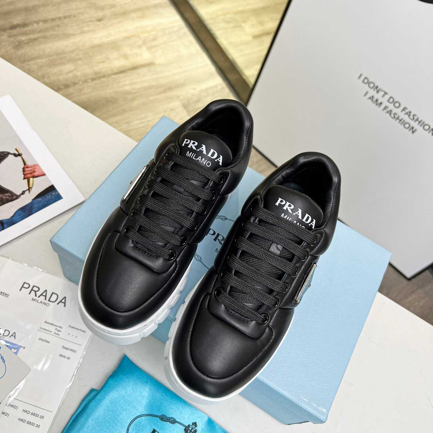 Prada Padded Nappa Leather Sneakers - FashionPlug