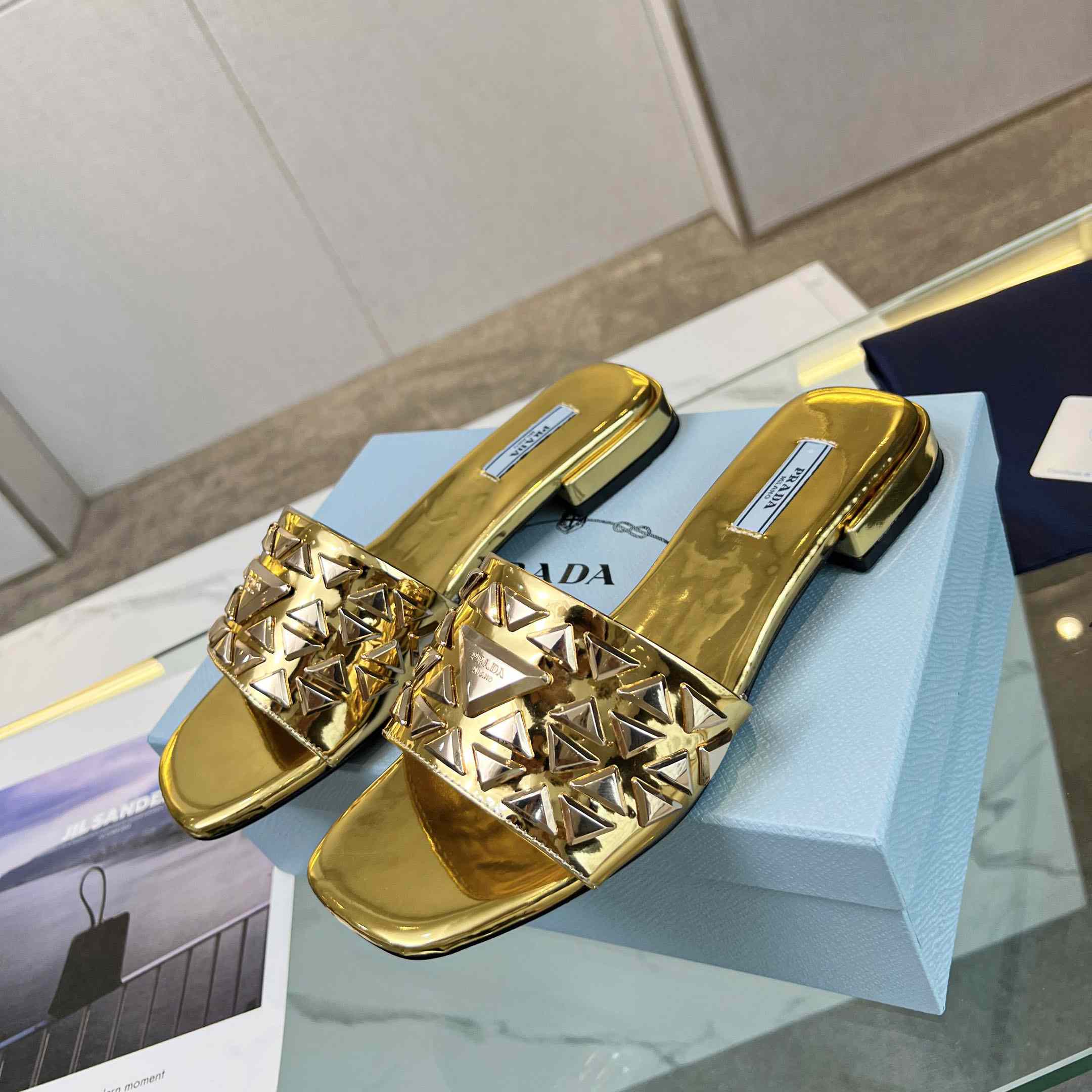Prada Studded Metallic Leather Slides - FashionPlug