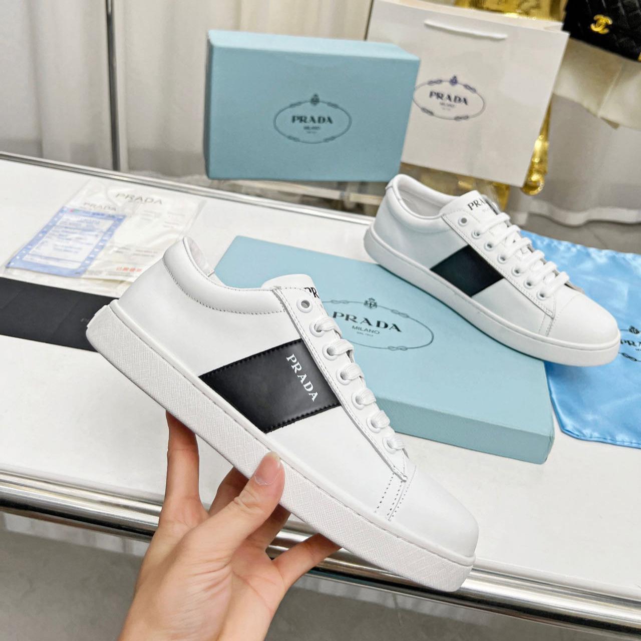 Prada Brushed Leather And Leather Sneakers - FashionPlug