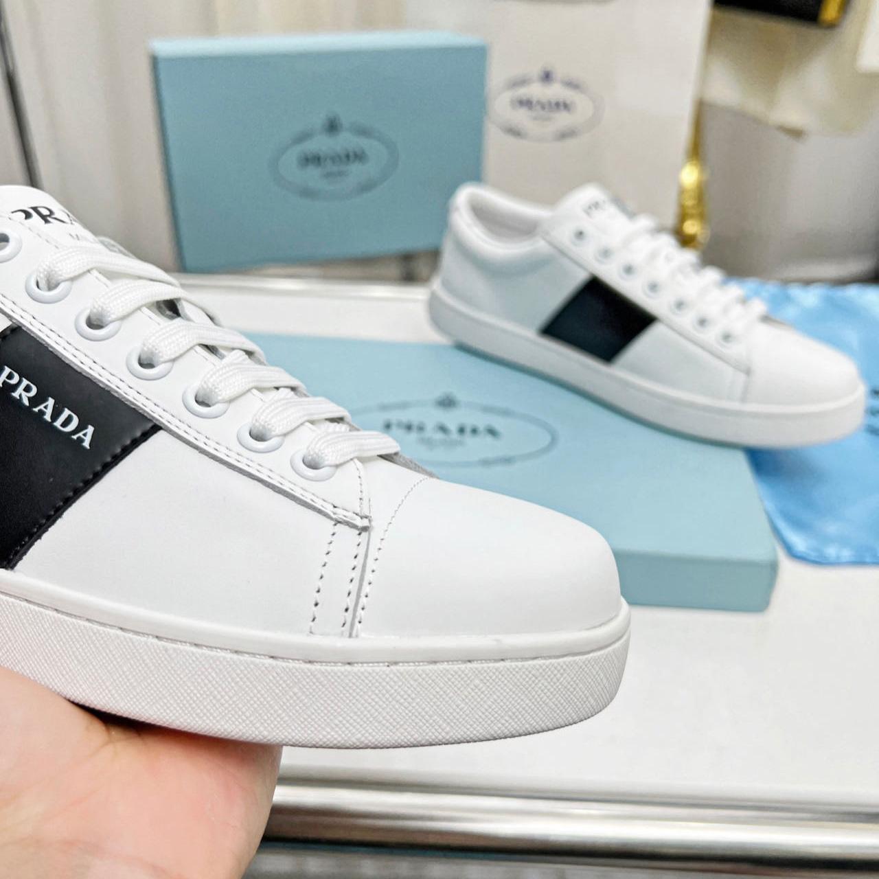 Prada Brushed Leather And Leather Sneakers - FashionPlug