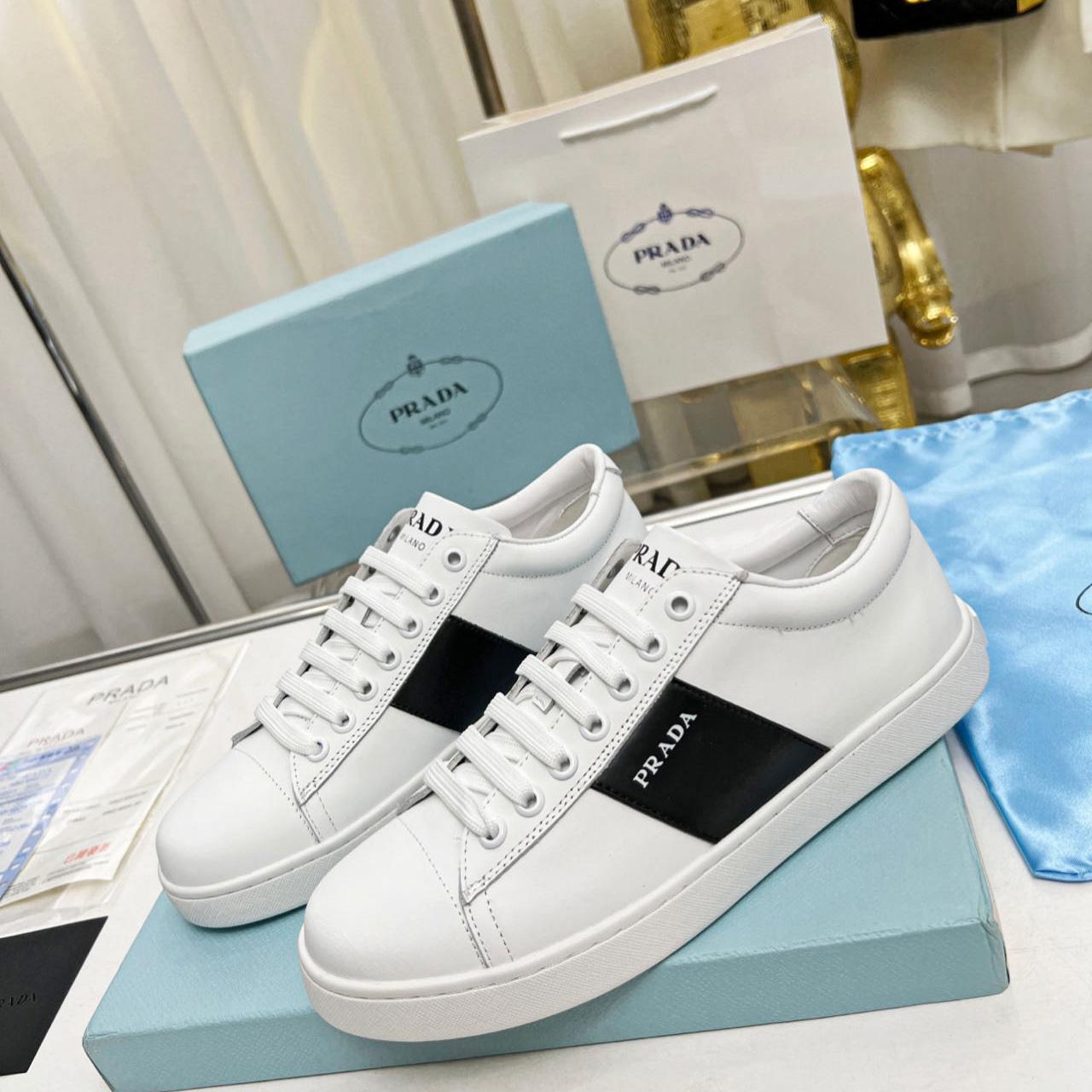 Prada Brushed Leather And Leather Sneakers - FashionPlug