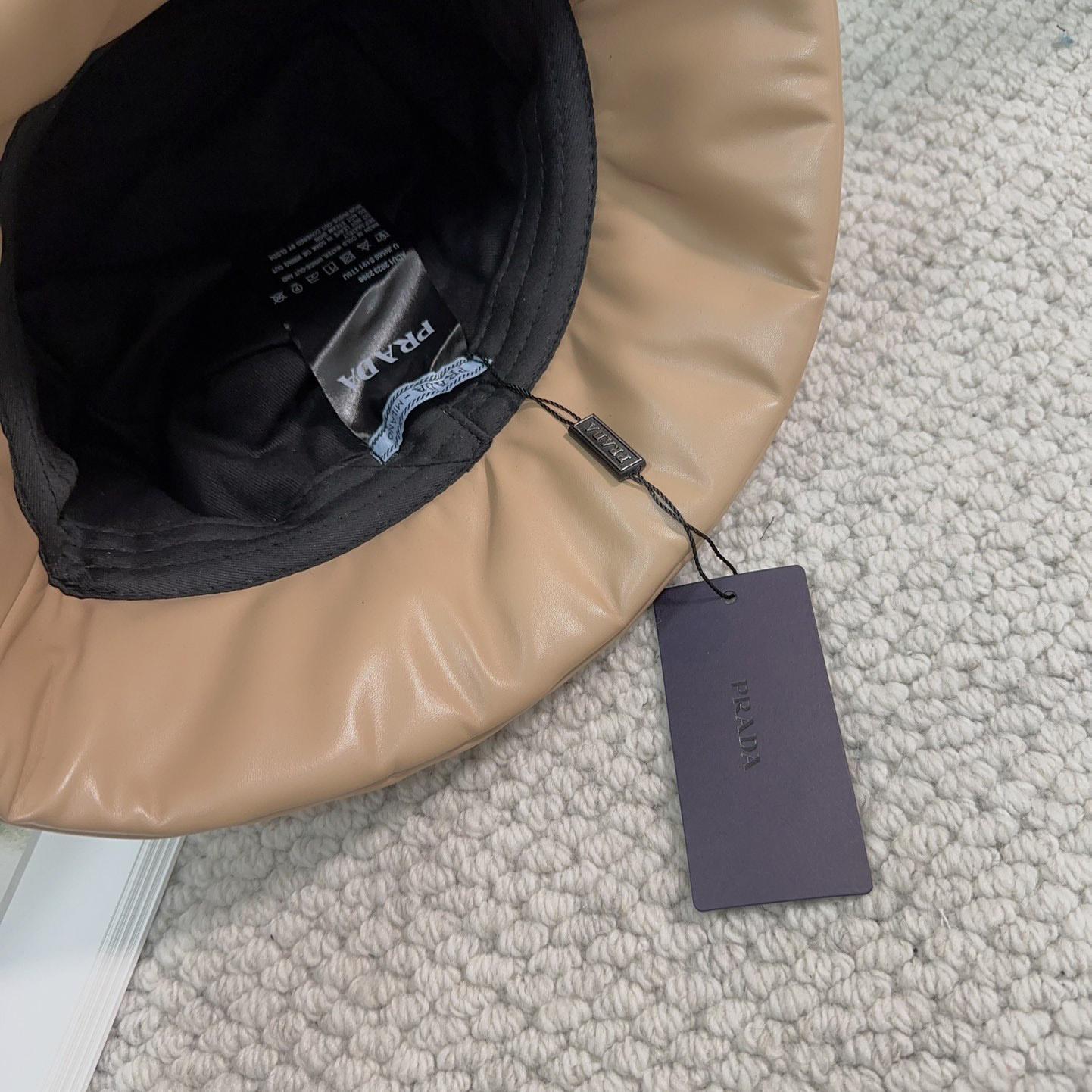 Prada Enamelled-logo Leather Bucket Hat - FashionPlug