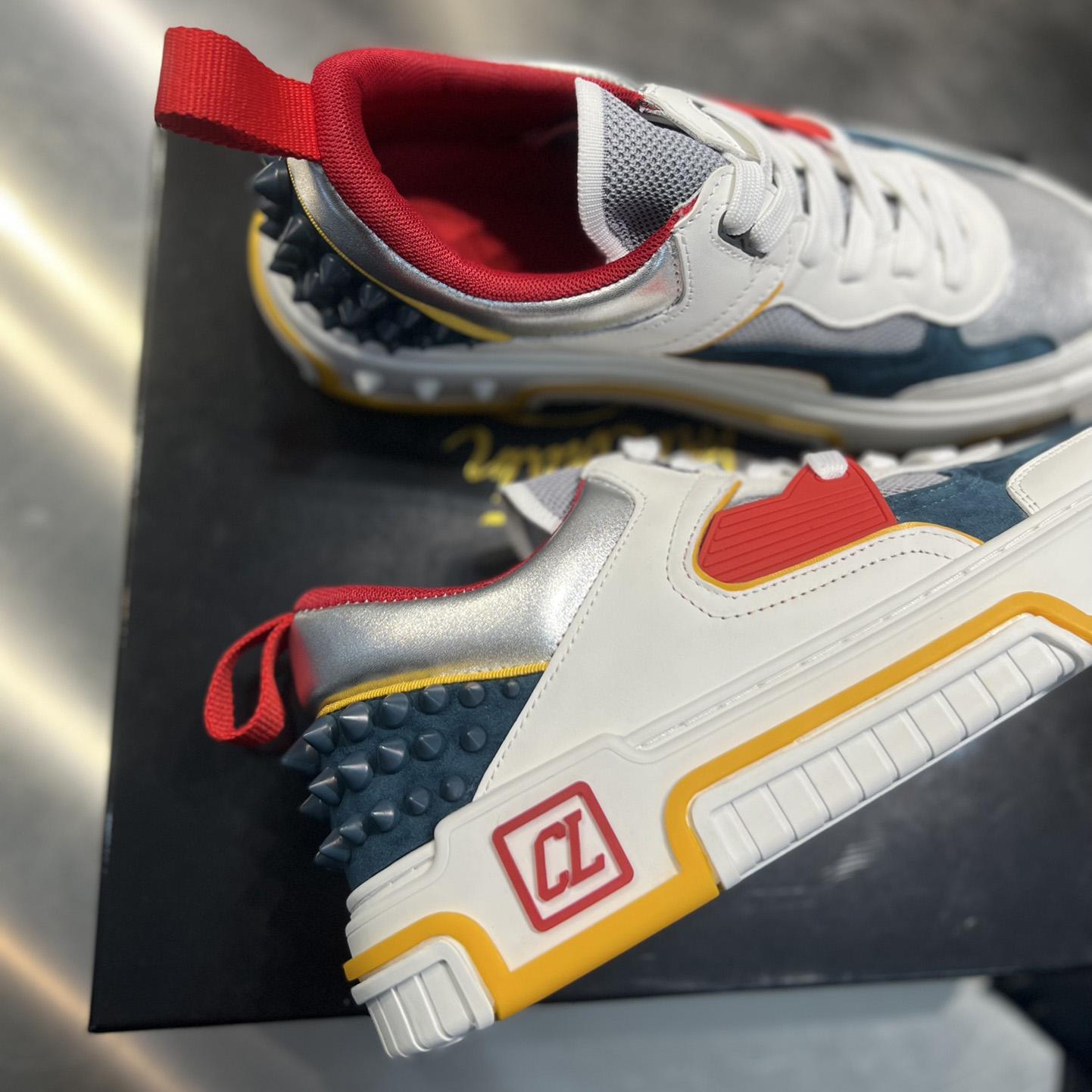 Christian Louboutin Astroloubi Sneakers - FashionPlug