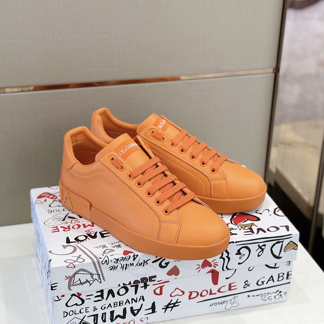 Dolce & Gabbana Embossed Logo Sneakers - FashionPlug