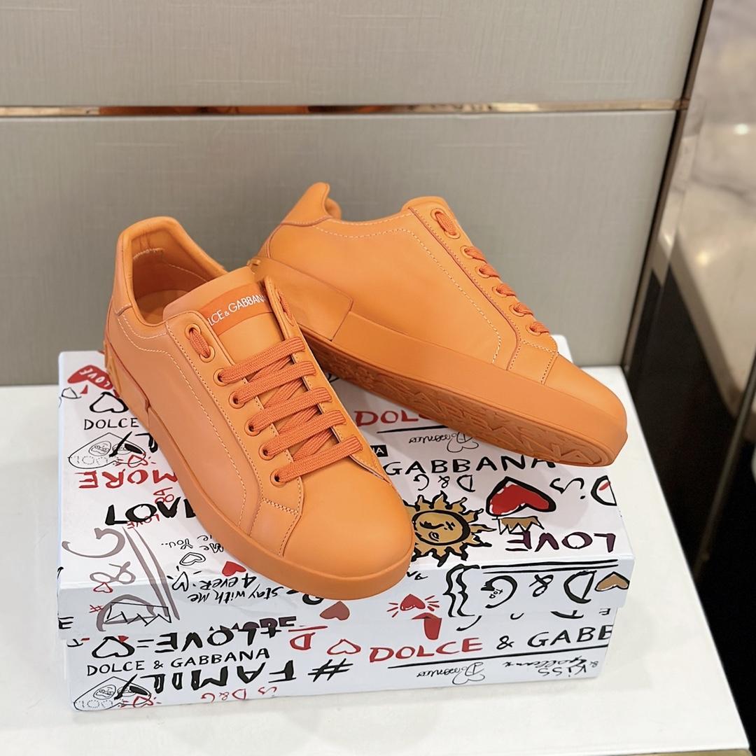 Dolce & Gabbana Embossed Logo Sneakers - FashionPlug