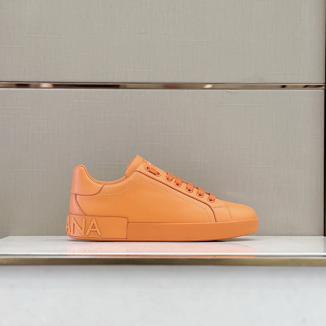 Dolce & Gabbana Embossed Logo Sneakers - FashionPlug
