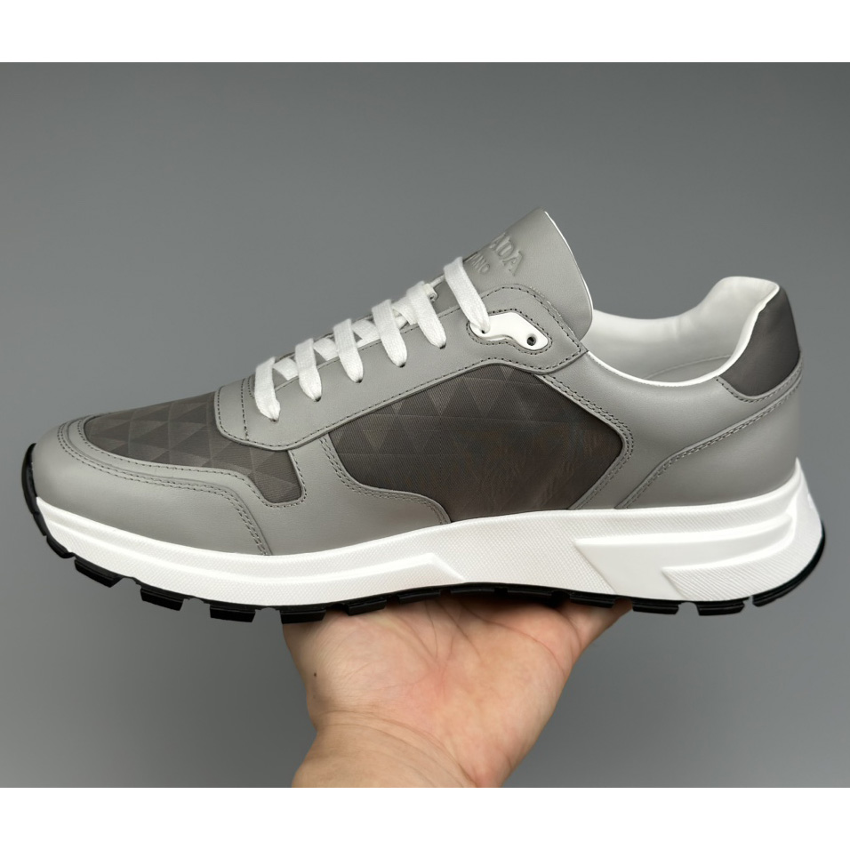 Prada Leather And Re-Nylon High-top Sneakers - FashionPlug