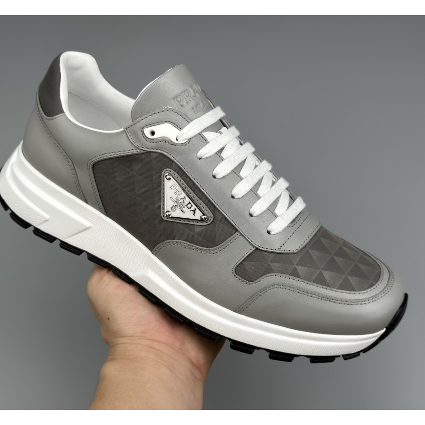 Prada Leather And Re-Nylon High-top Sneakers - FashionPlug