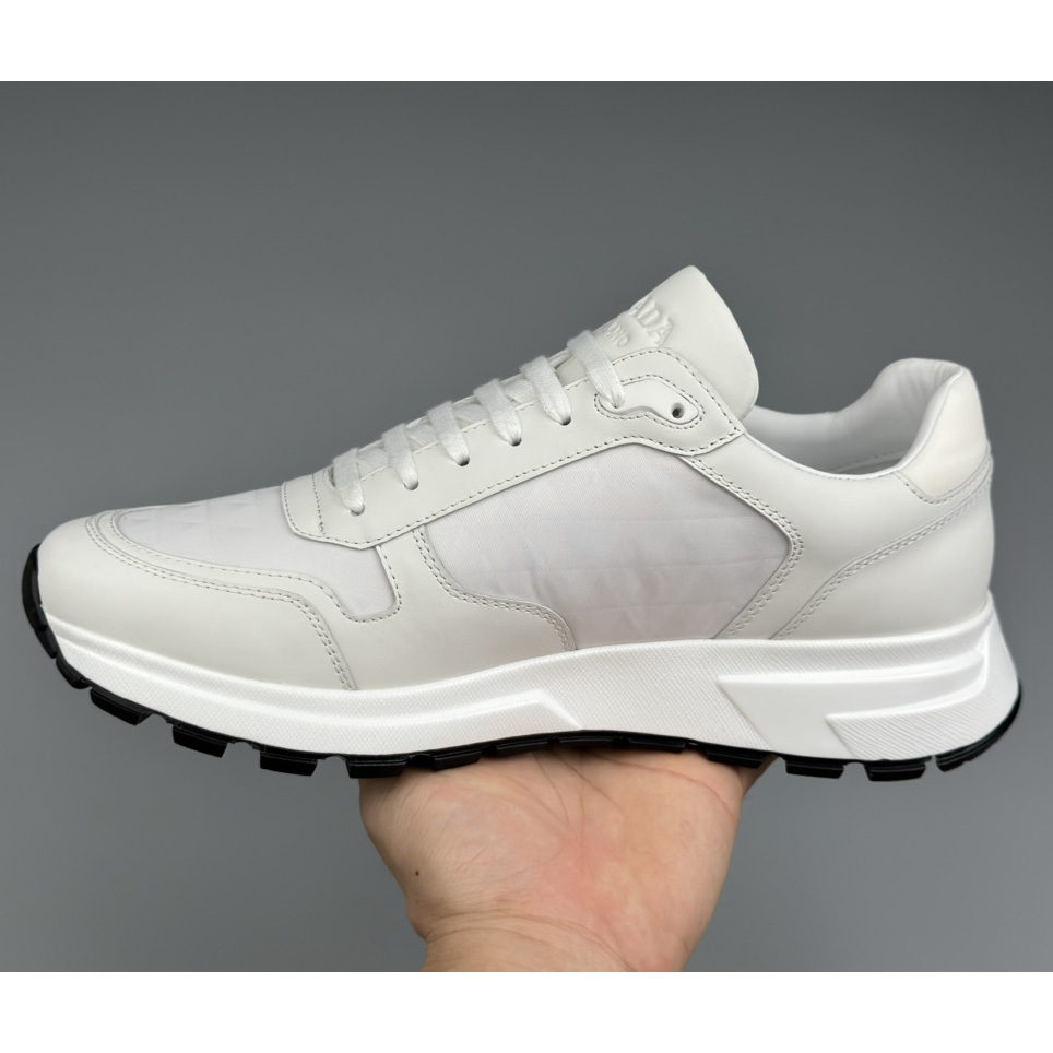 Prada Leather And Re-Nylon High-top Sneakers - FashionPlug