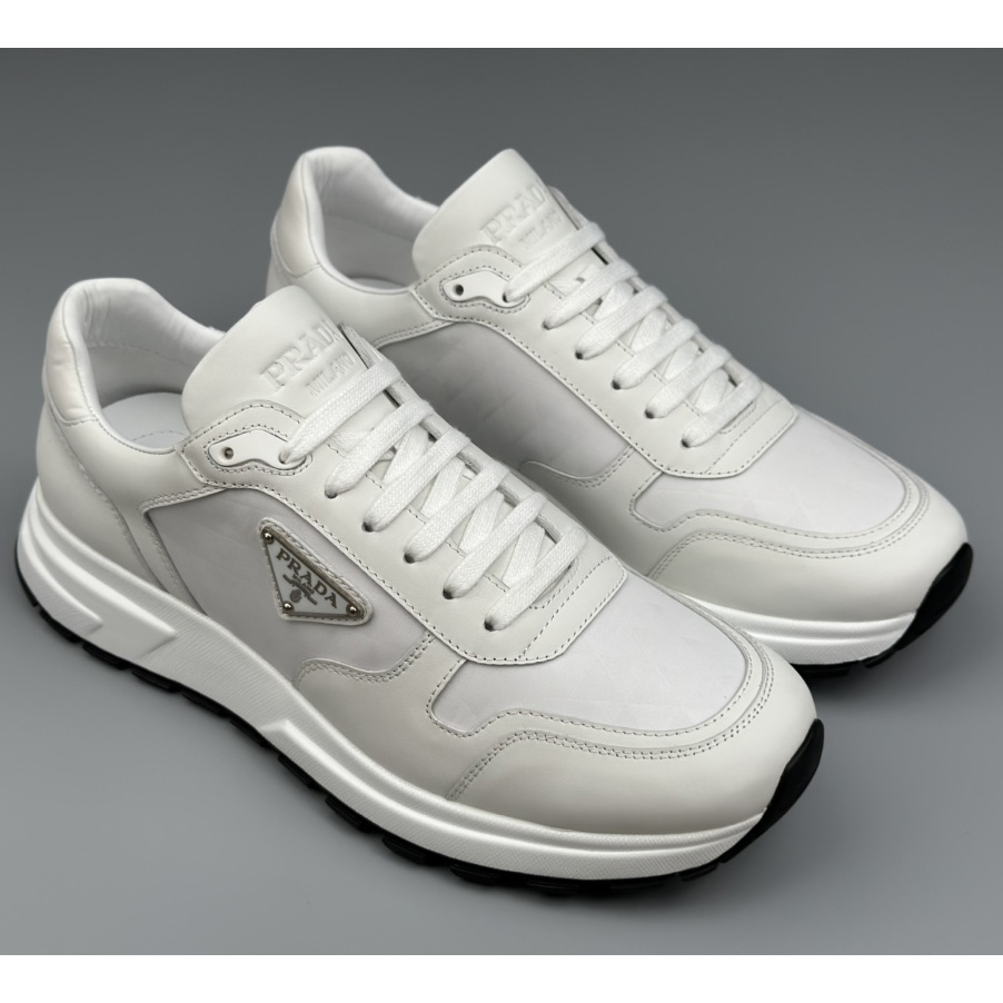 Prada Leather And Re-Nylon High-top Sneakers - FashionPlug
