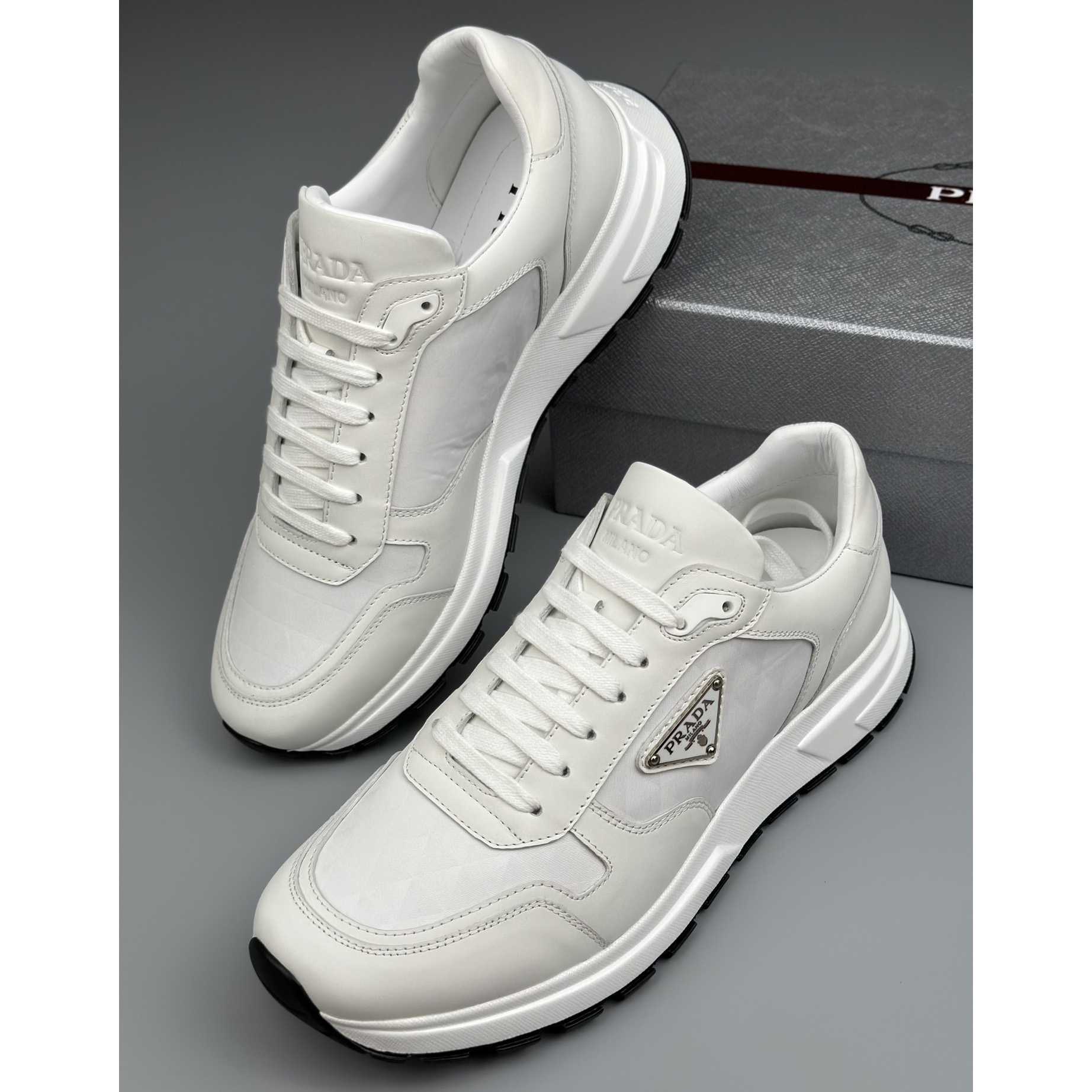 Prada Leather And Re-Nylon High-top Sneakers - FashionPlug