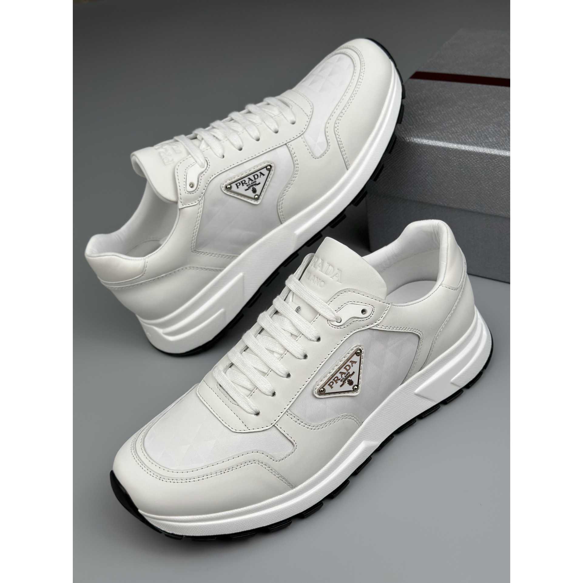 Prada Leather And Re-Nylon High-top Sneakers - FashionPlug