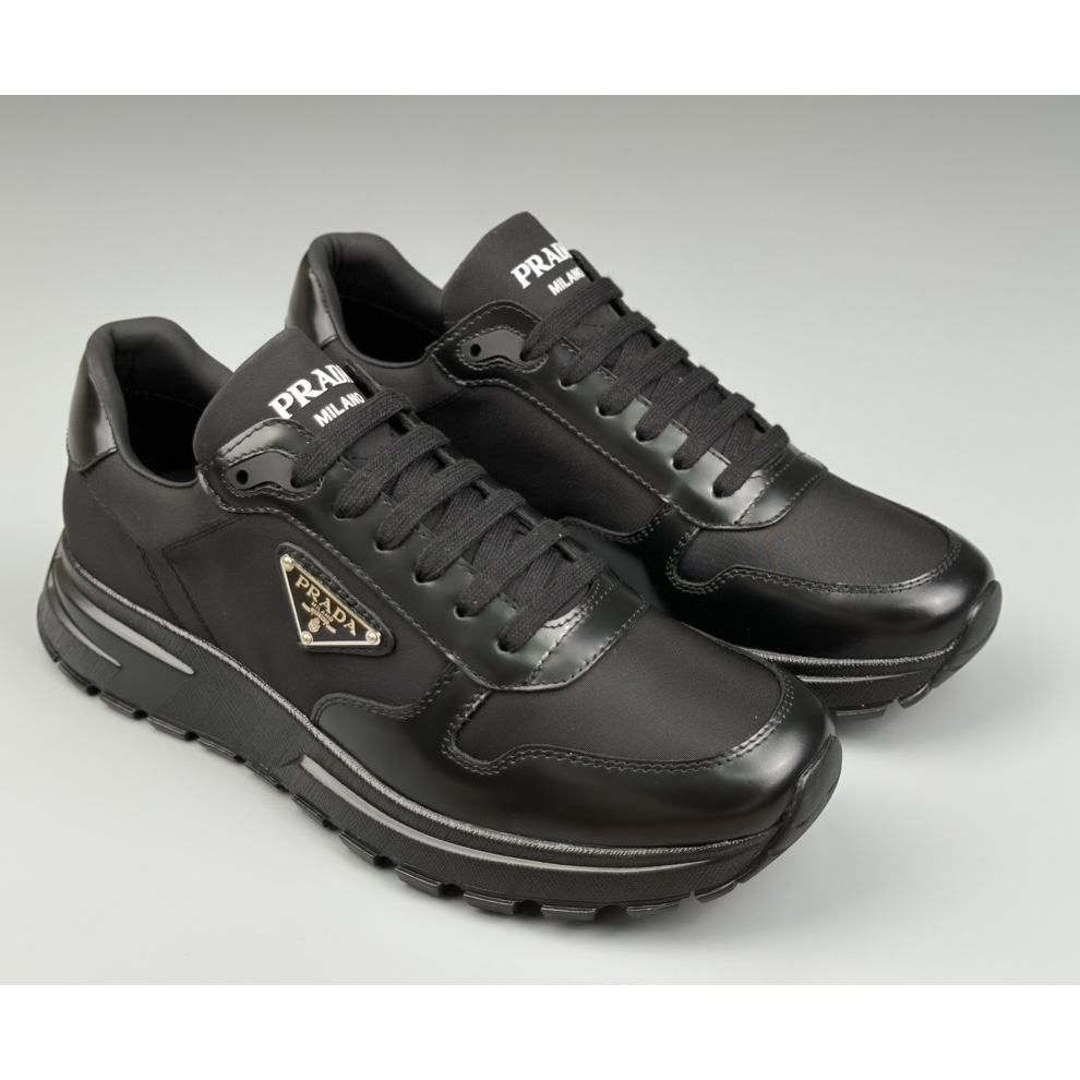 Prada Re-Nylon And Brushed Leather Sneakers - FashionPlug