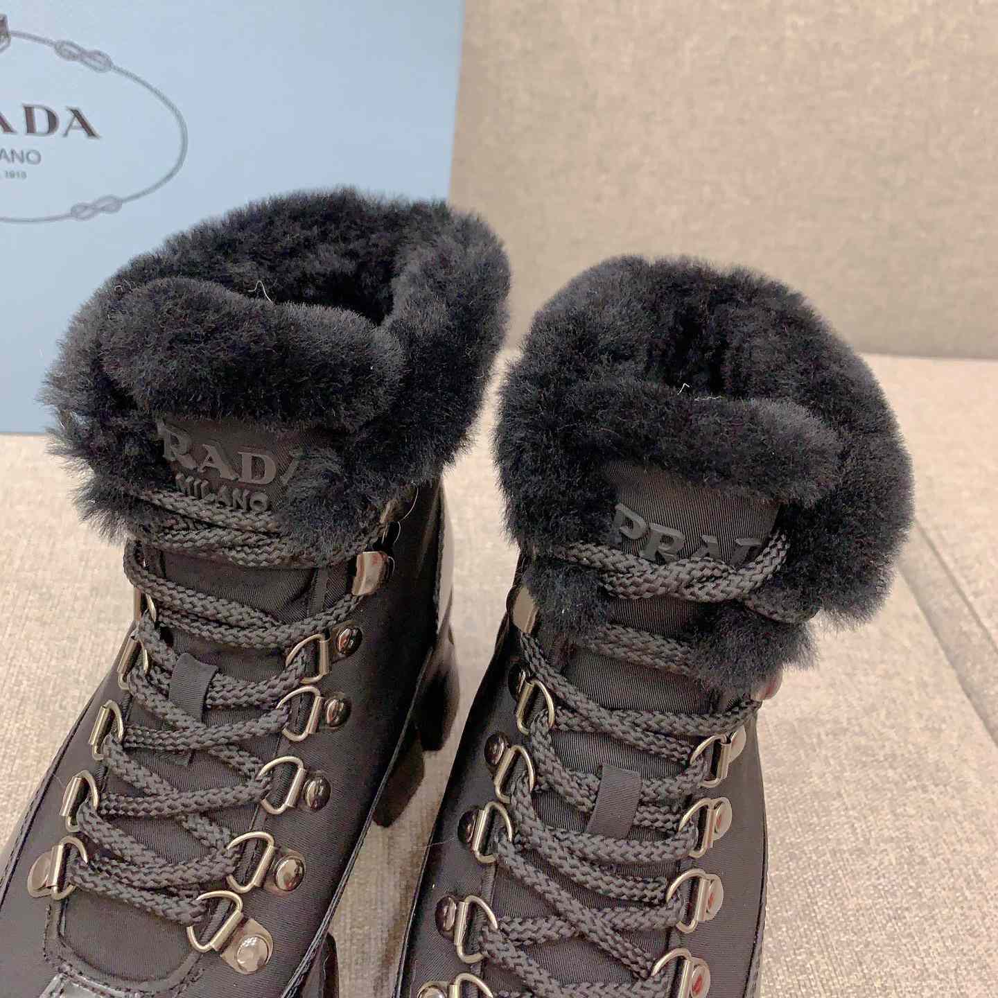 Prada Monolith Leather And Nylon Booties - FashionPlug