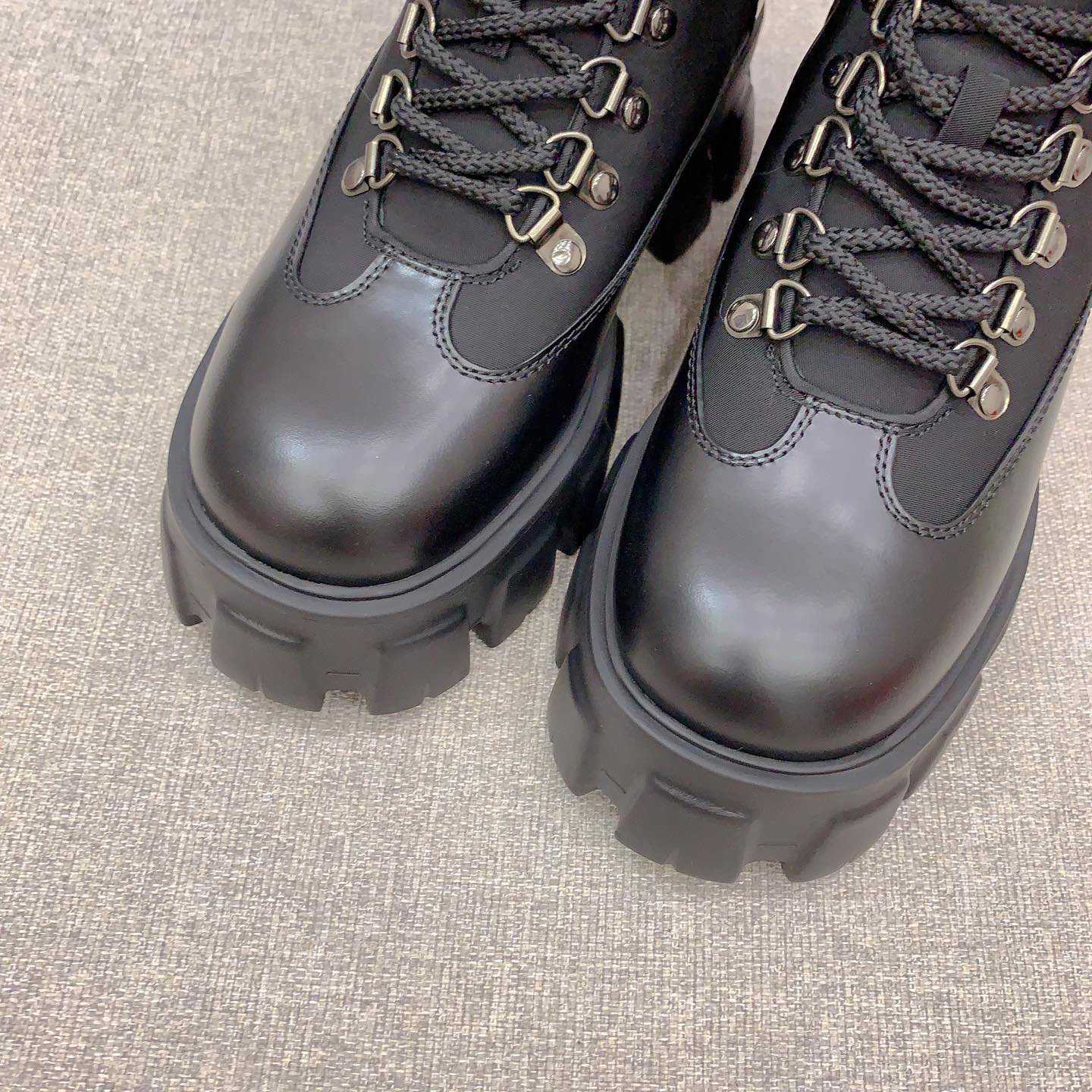 Prada Monolith Leather And Nylon Booties - FashionPlug