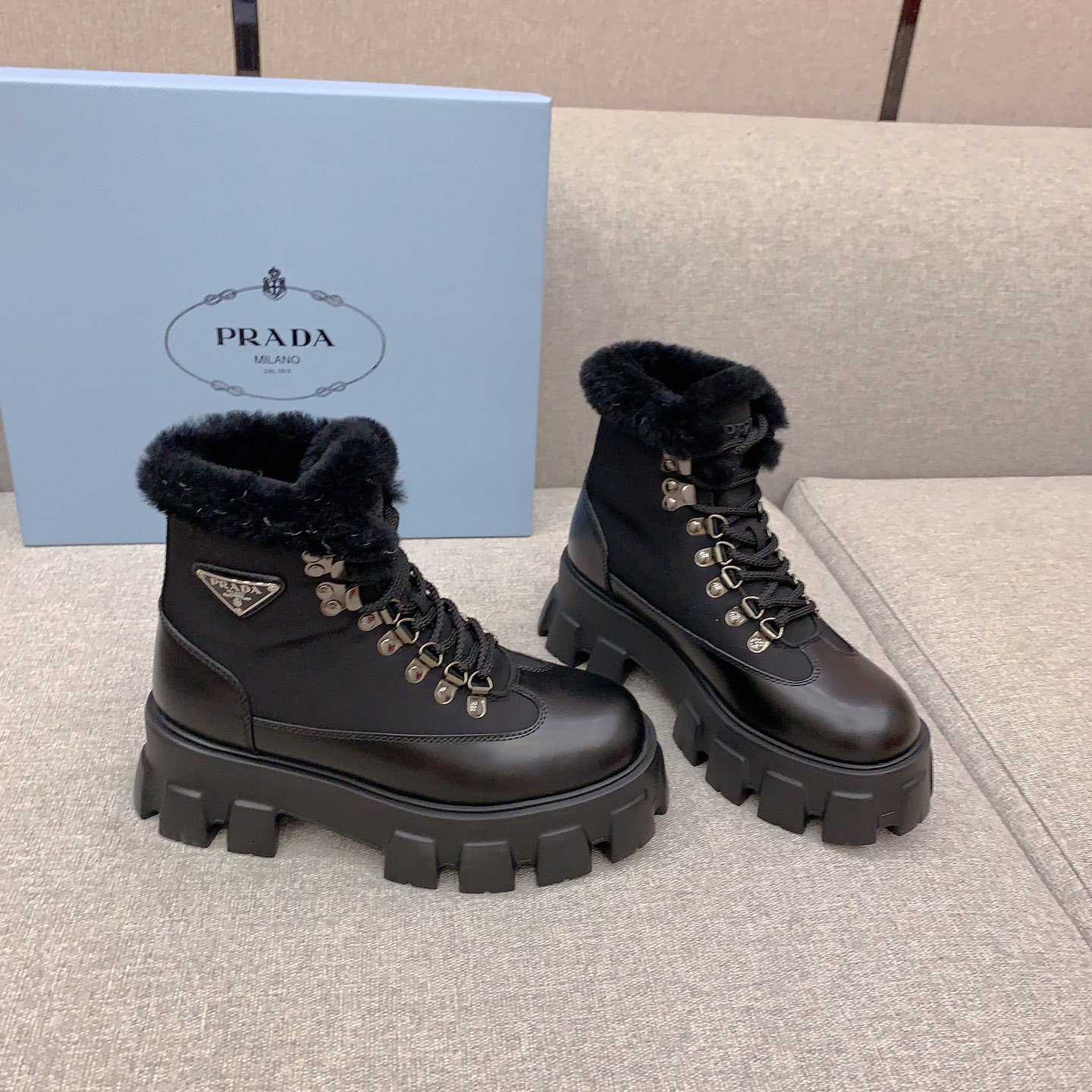 Prada Monolith Leather And Nylon Booties - FashionPlug