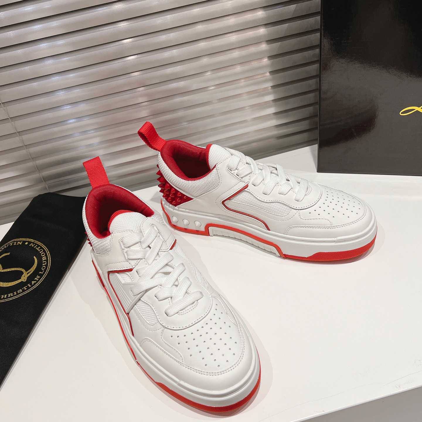 Christian Louboutin Astroloubi Sneakers - FashionPlug
