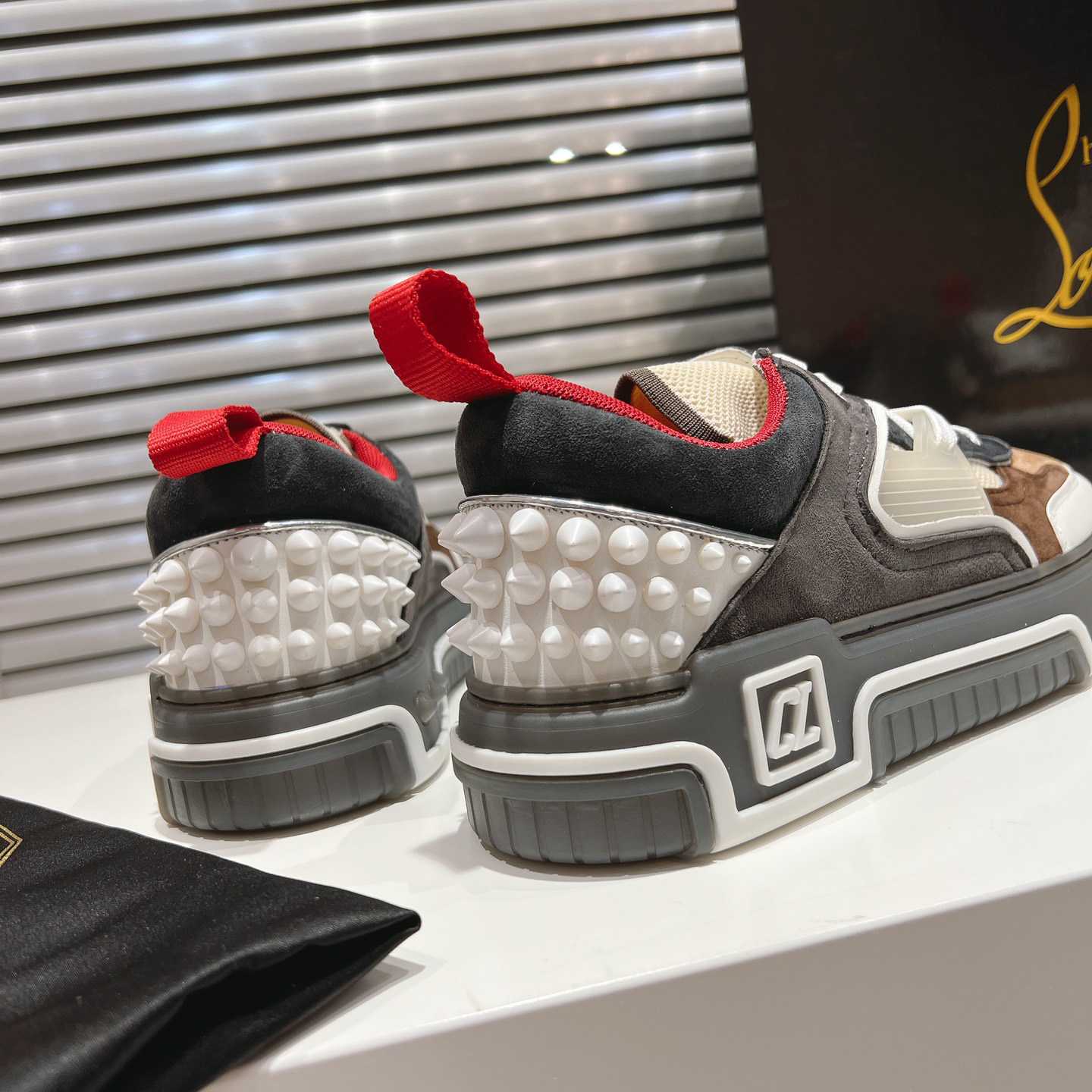 Christian Louboutin Astroloubi Sneakers - FashionPlug