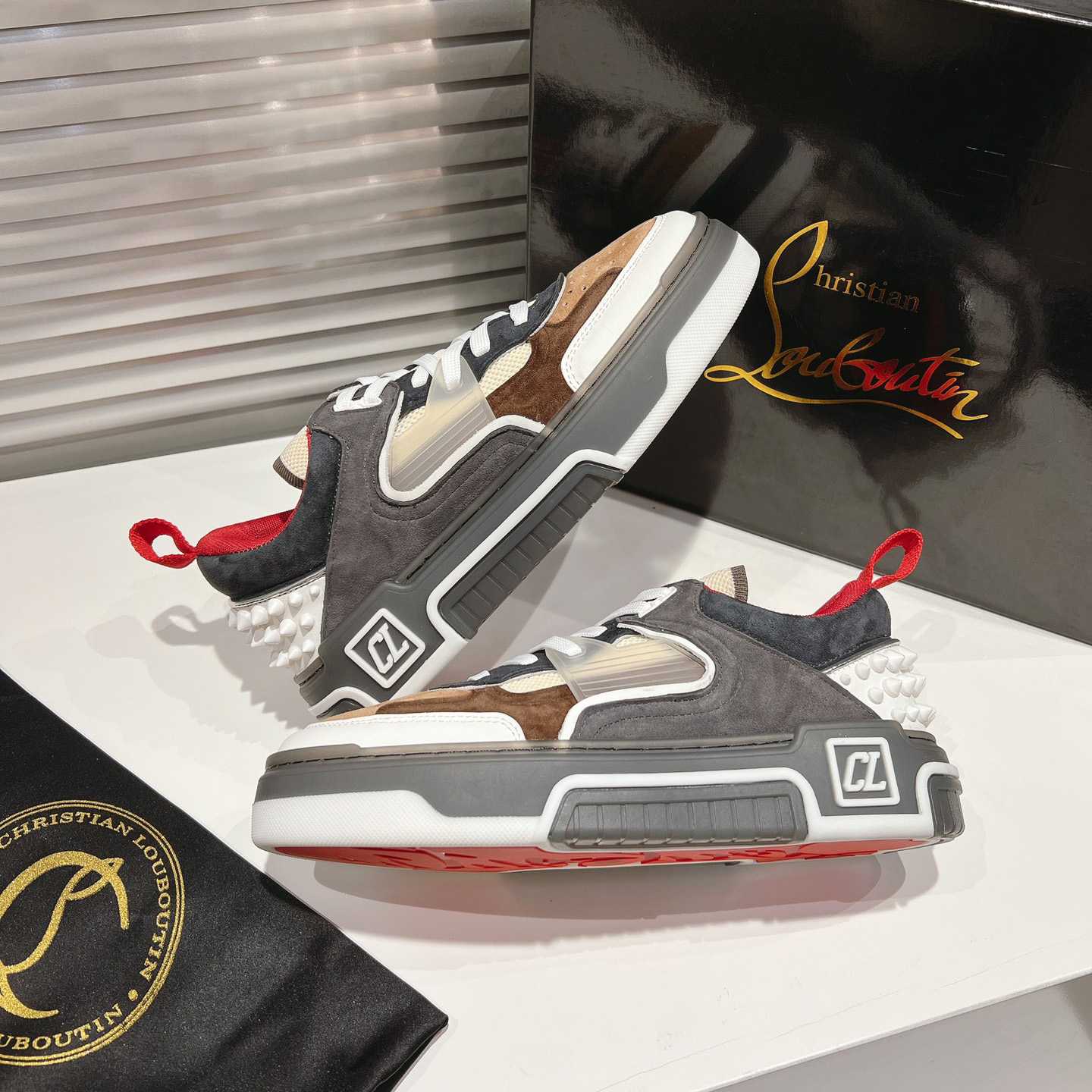 Christian Louboutin Astroloubi Sneakers - FashionPlug