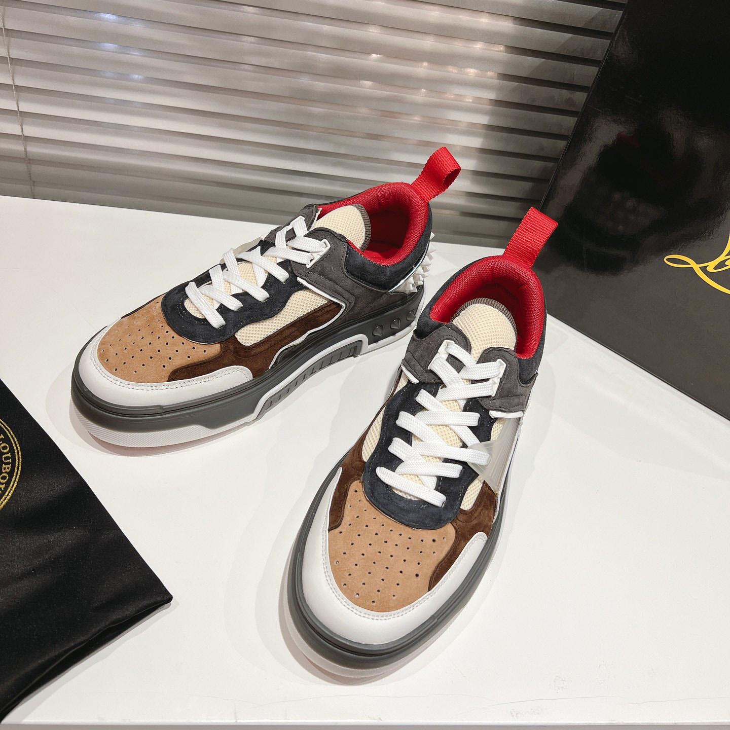 Christian Louboutin Astroloubi Sneakers - FashionPlug