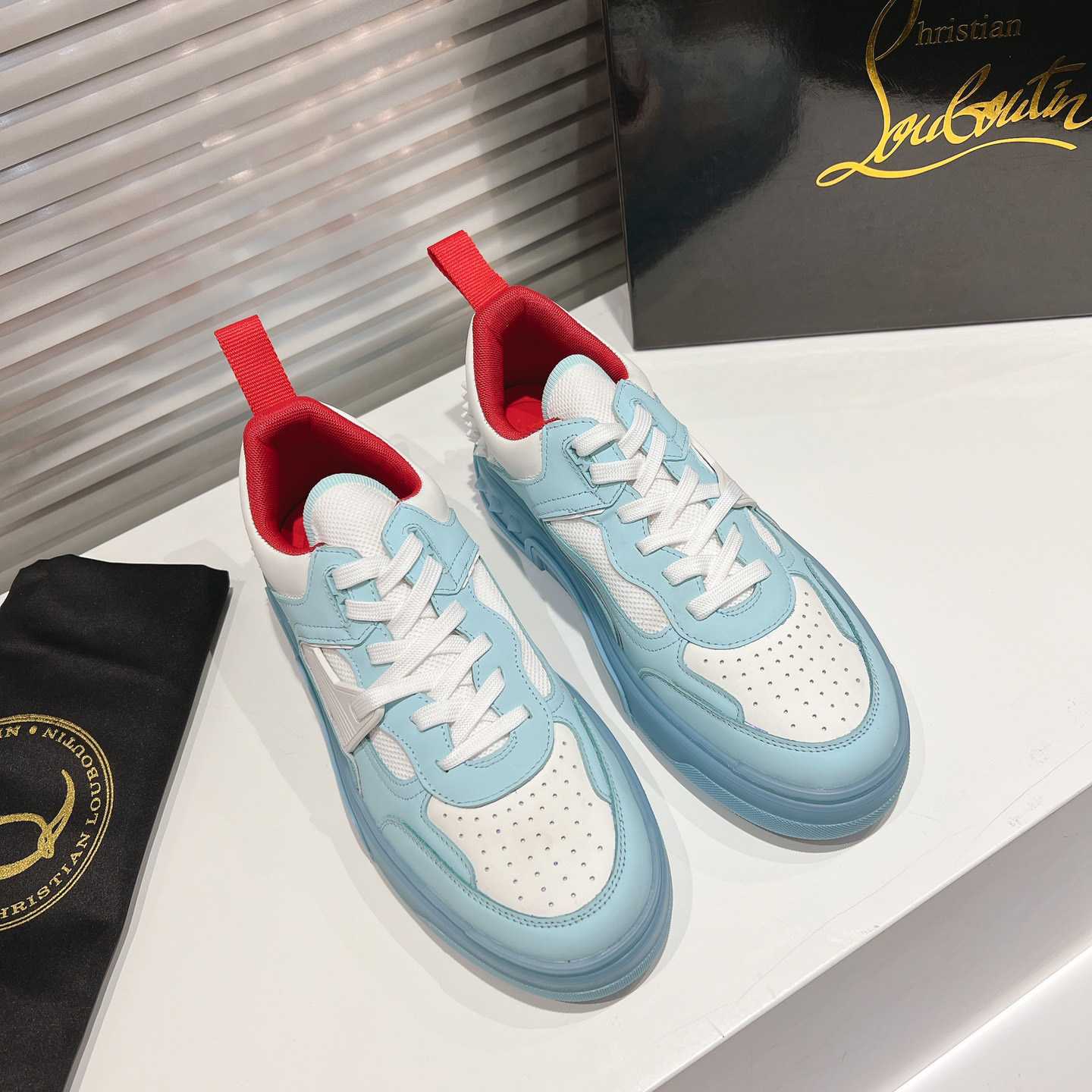 Christian Louboutin Astroloubi Sneakers - FashionPlug