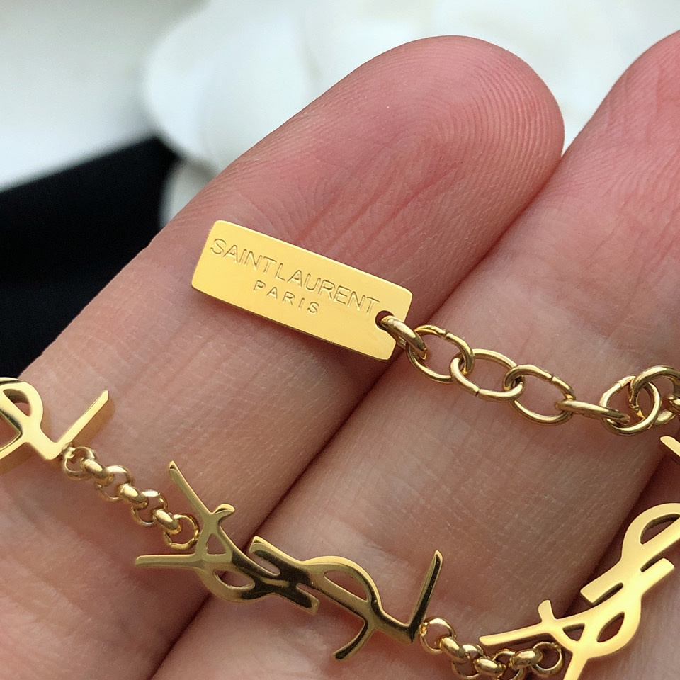 Saint Laurent Cassandre Multi-charm Bracelet In Metal - FashionPlug