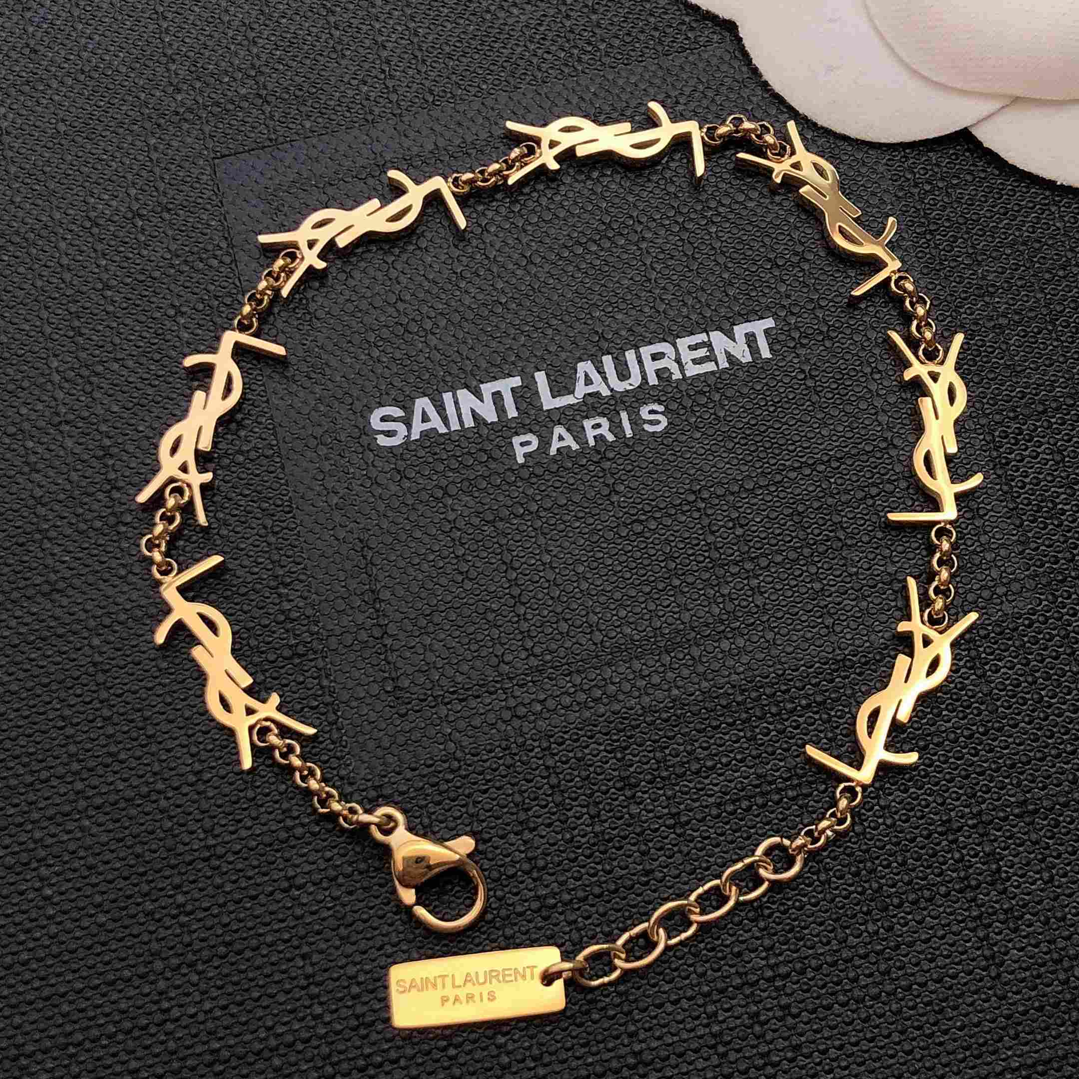 Saint Laurent Cassandre Multi-charm Bracelet In Metal - FashionPlug