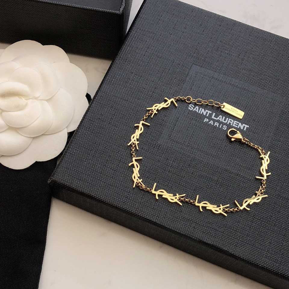 Saint Laurent Cassandre Multi-charm Bracelet In Metal - FashionPlug