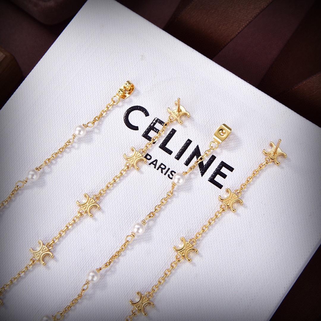 Celine Triomphe Long Pearl Earrings In Brass With Gold Finish And Resin Pearls - FashionPlug
