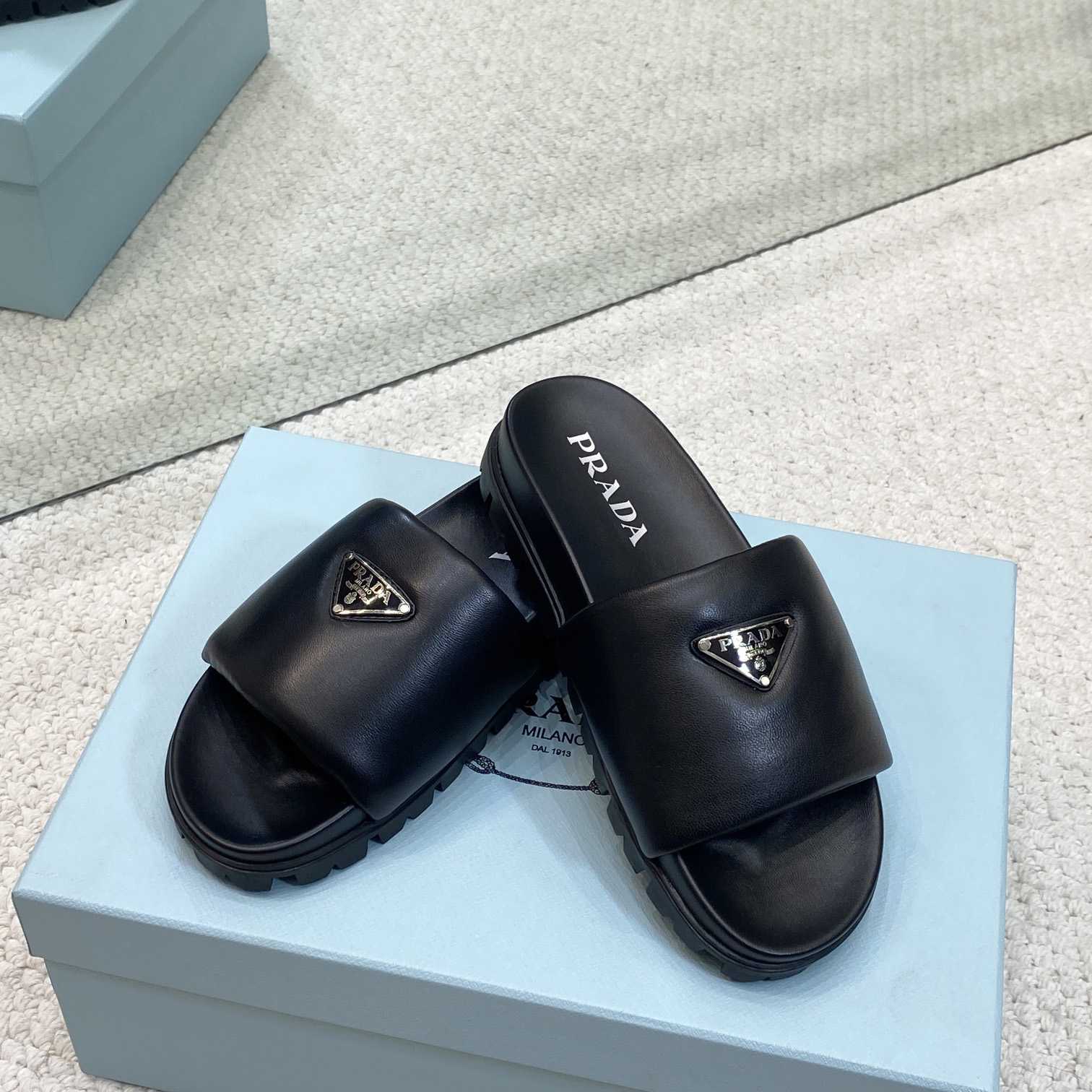 Prada Padded Nappa Leather Slides - FashionPlug