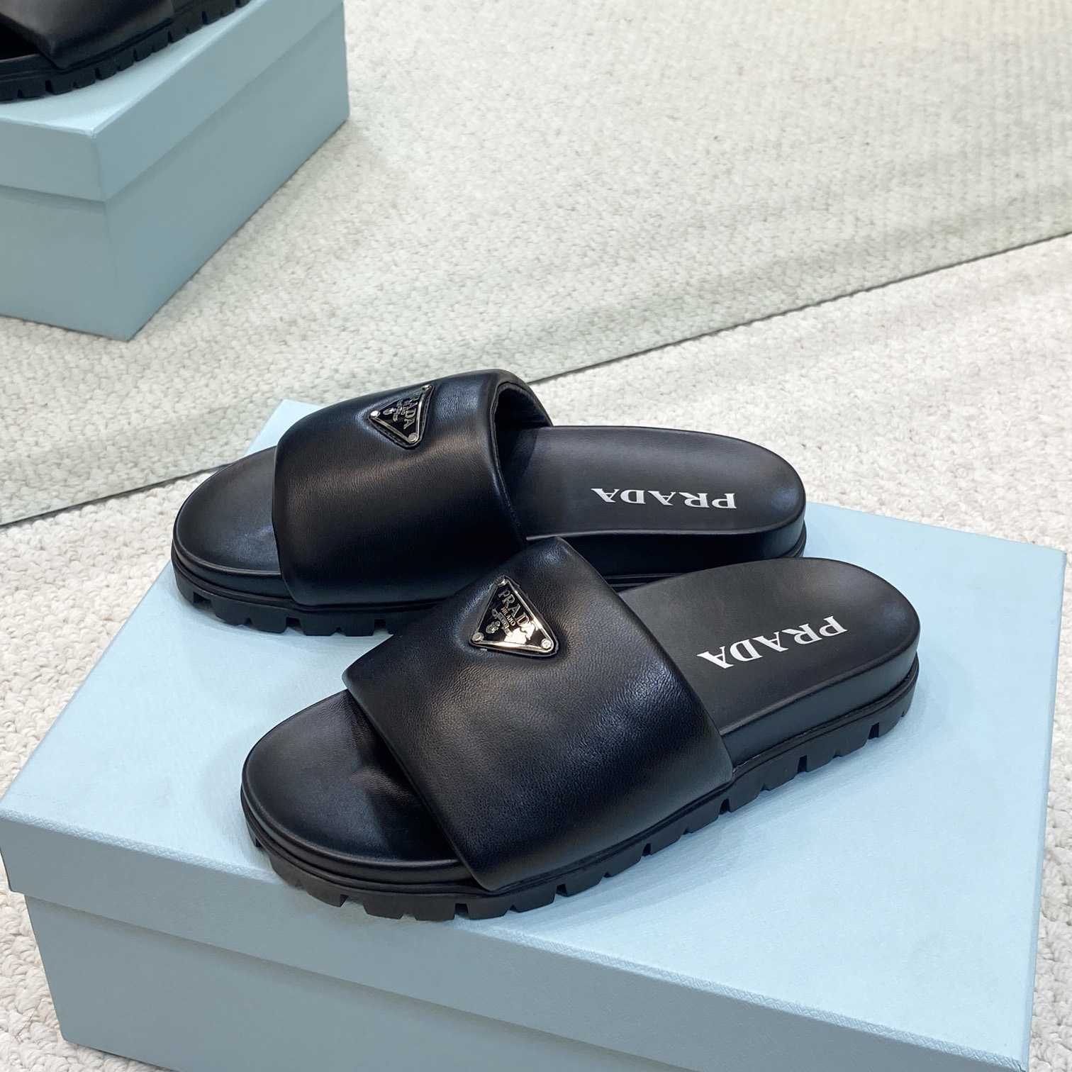 Prada Padded Nappa Leather Slides - FashionPlug