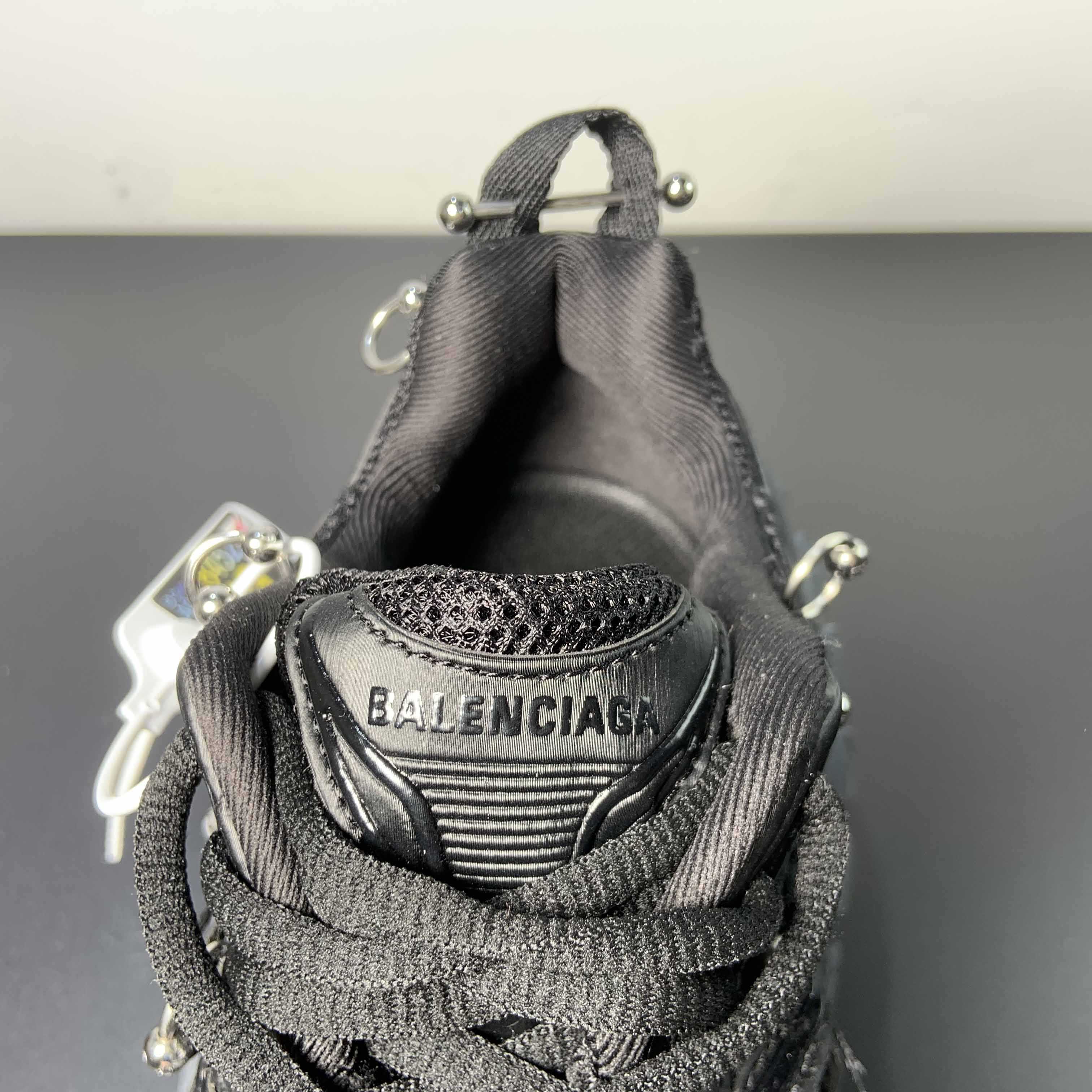 Balenciaga Bouncer Screw Sneaker With Piercings In Black - FashionPlug