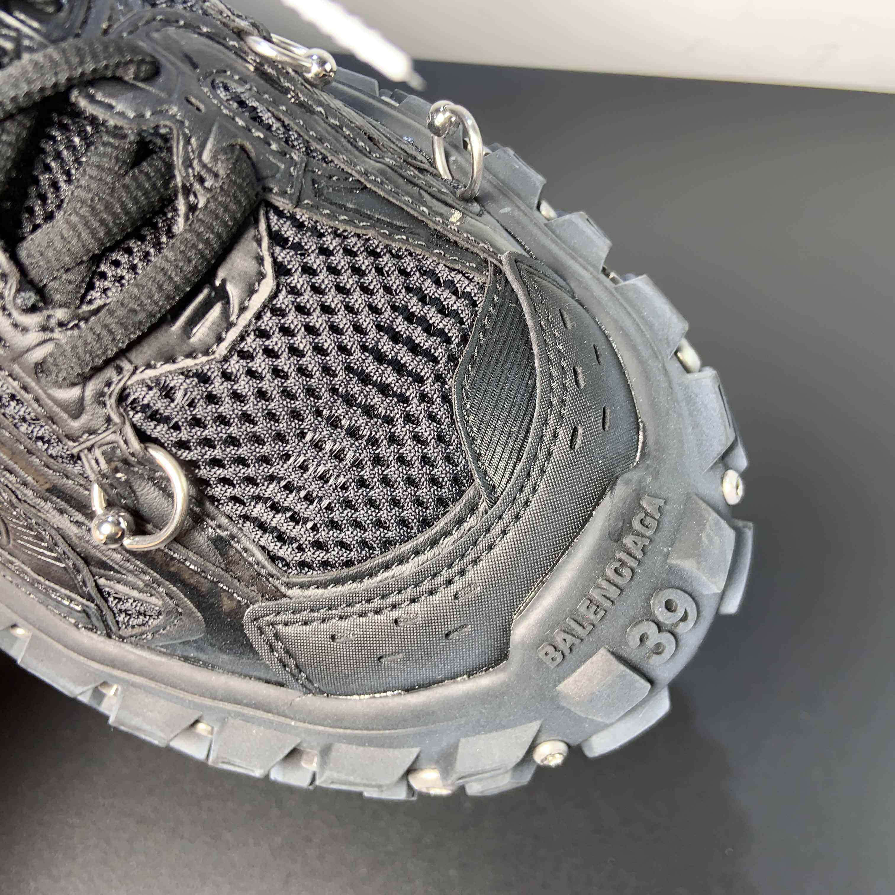 Balenciaga Bouncer Screw Sneaker With Piercings In Black - FashionPlug