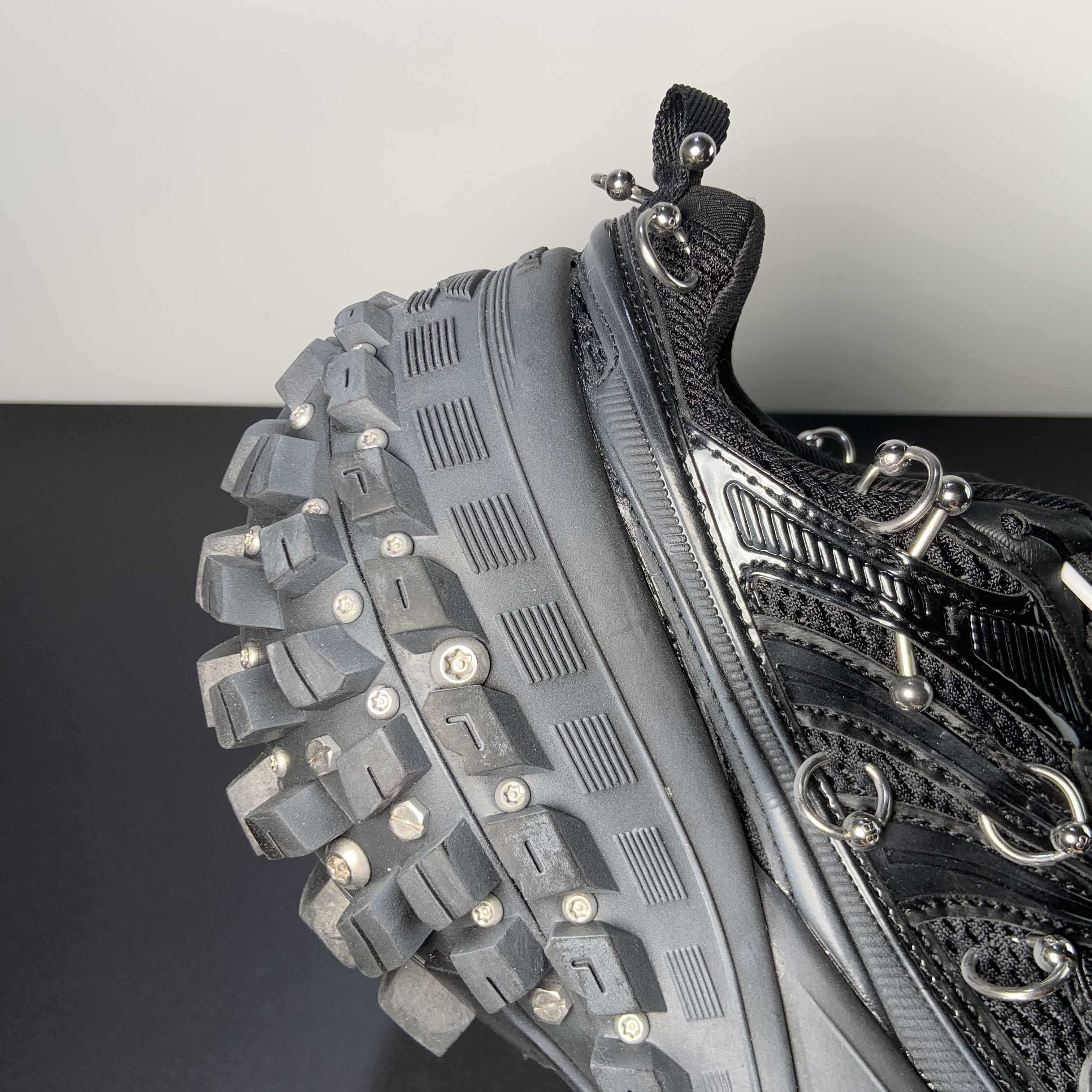 Balenciaga Bouncer Screw Sneaker With Piercings In Black - FashionPlug