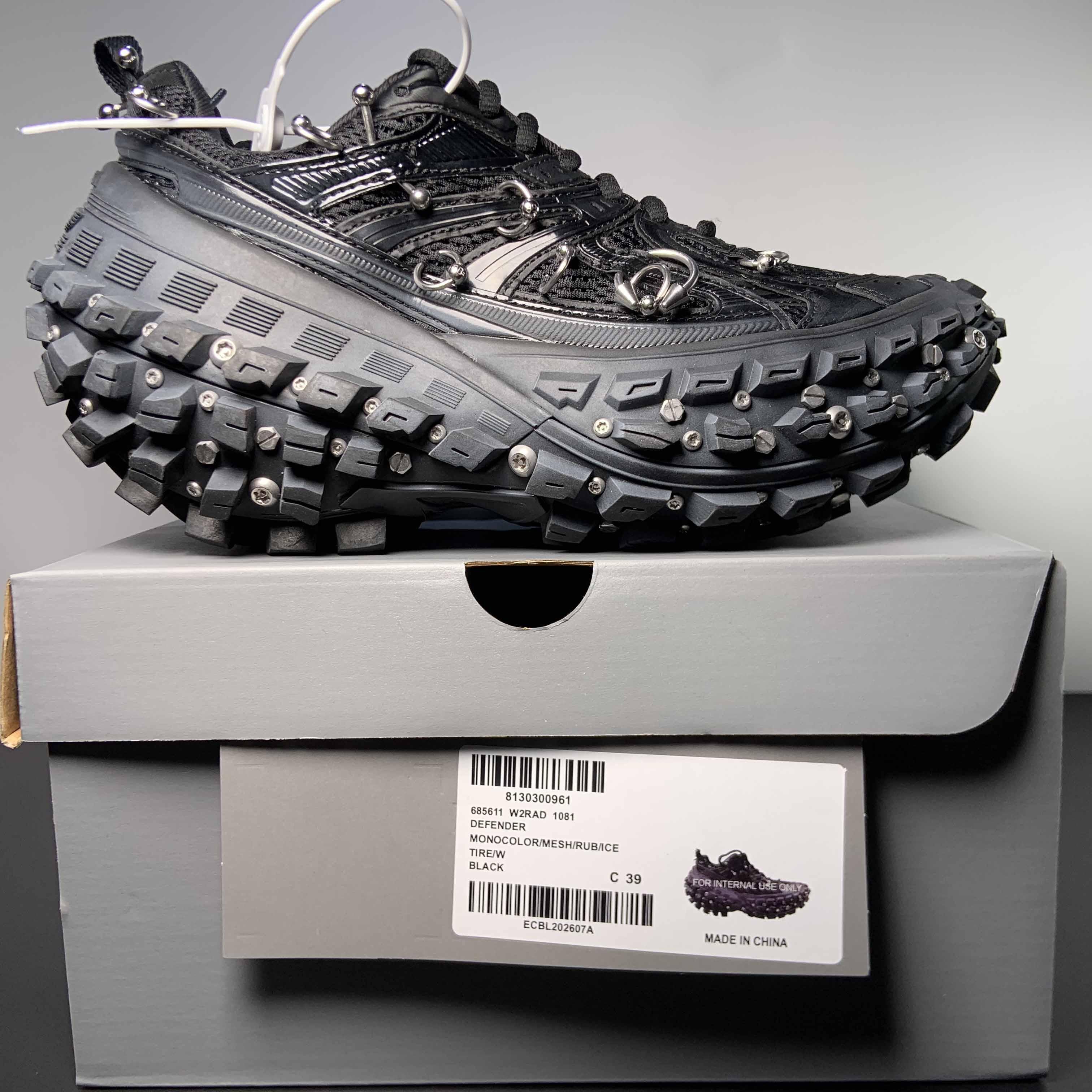 Balenciaga Bouncer Screw Sneaker With Piercings In Black - FashionPlug