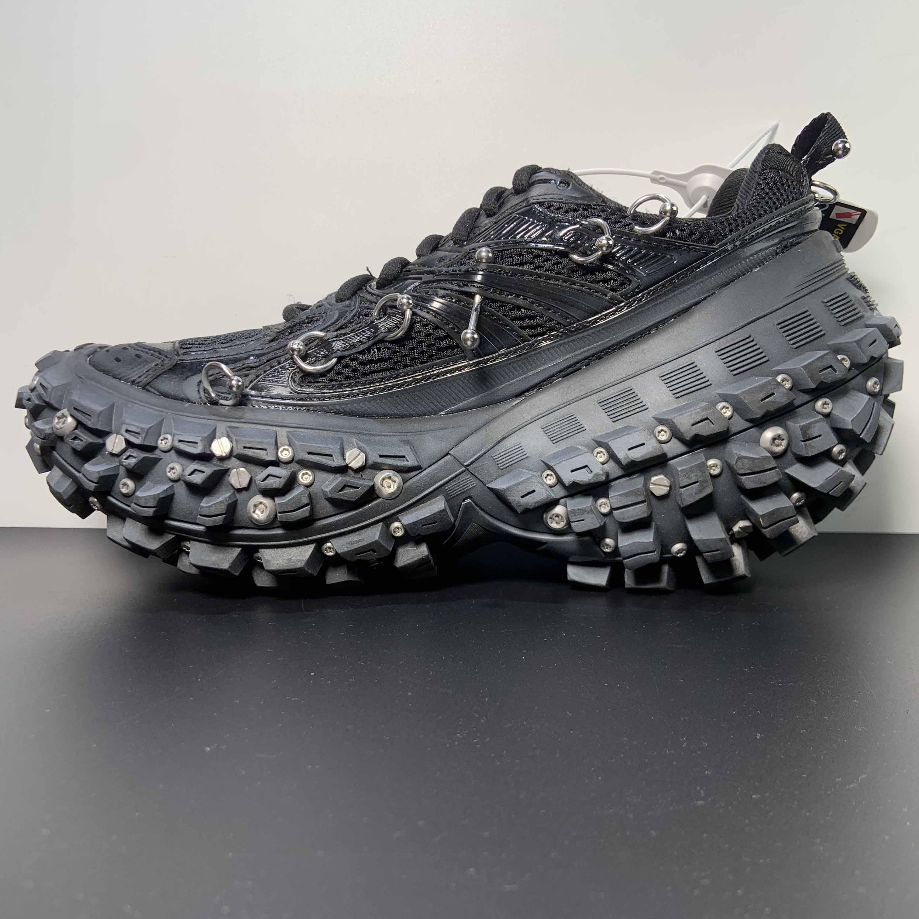 Balenciaga Bouncer Screw Sneaker With Piercings In Black - FashionPlug