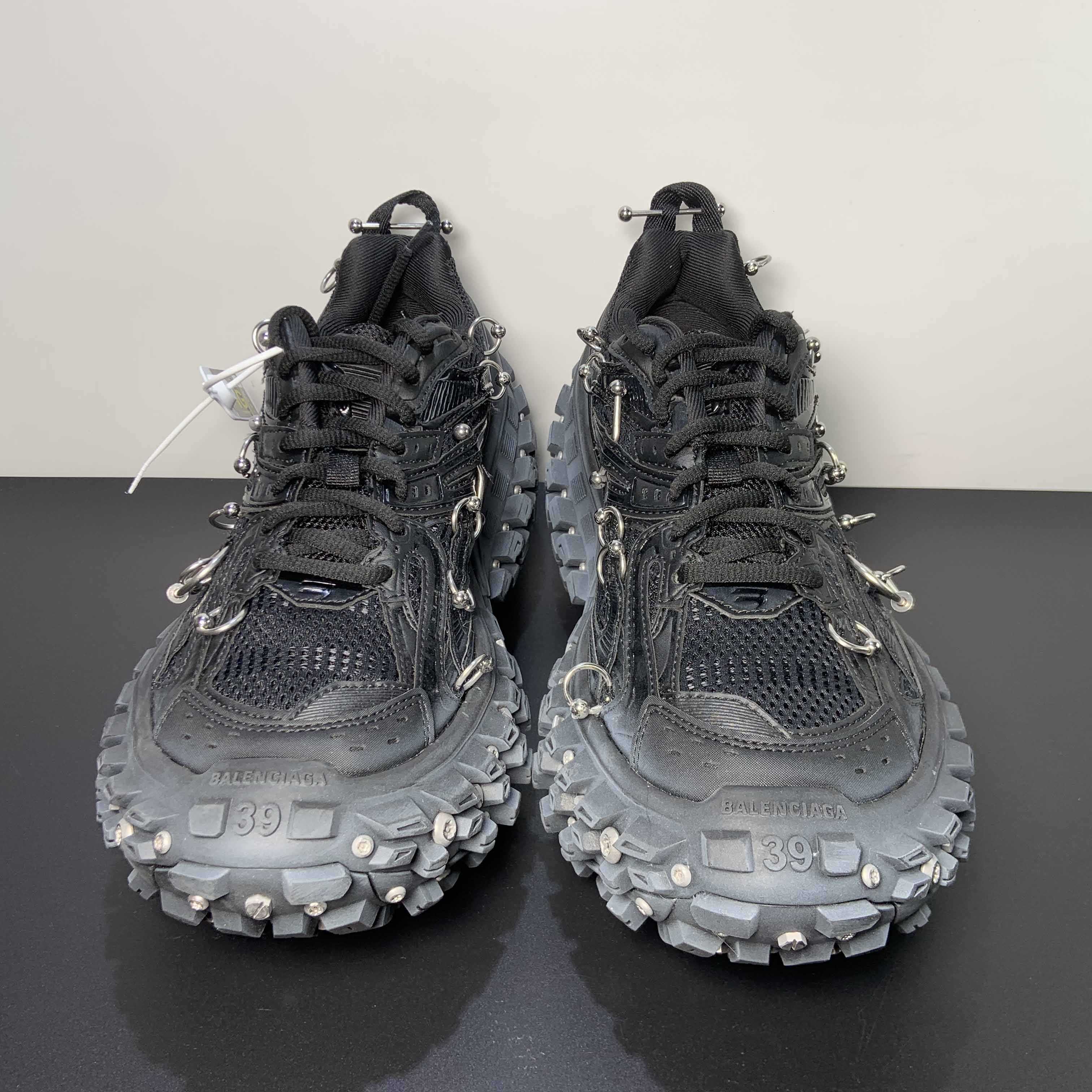 Balenciaga Bouncer Screw Sneaker With Piercings In Black - FashionPlug
