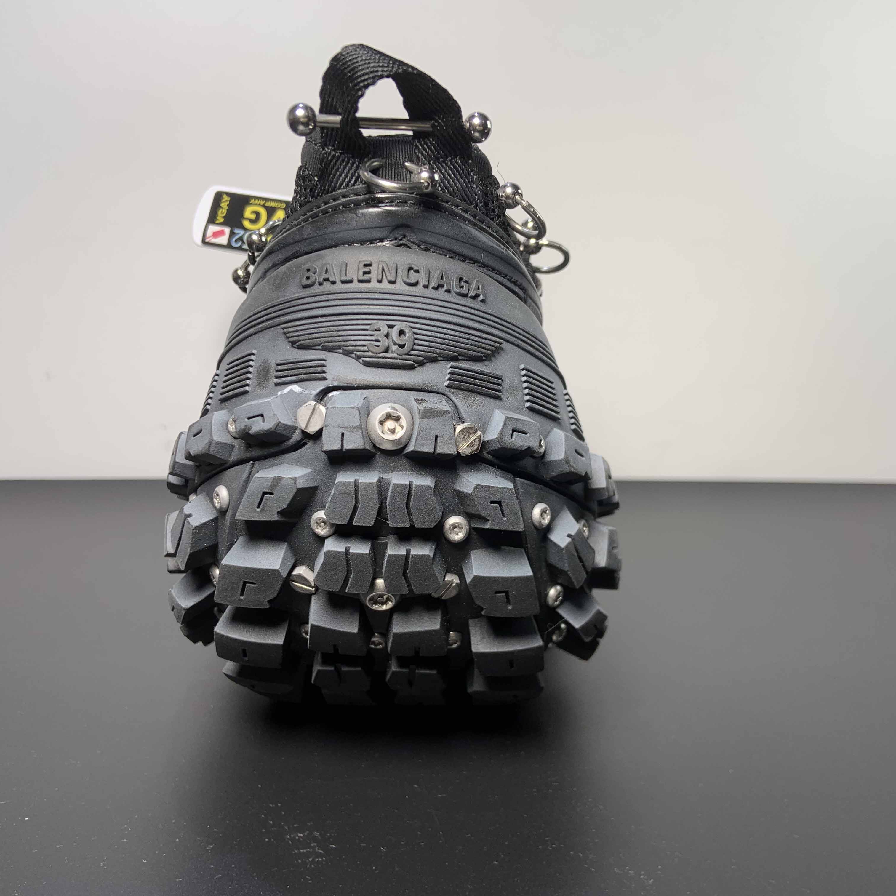Balenciaga Bouncer Screw Sneaker With Piercings In Black - FashionPlug