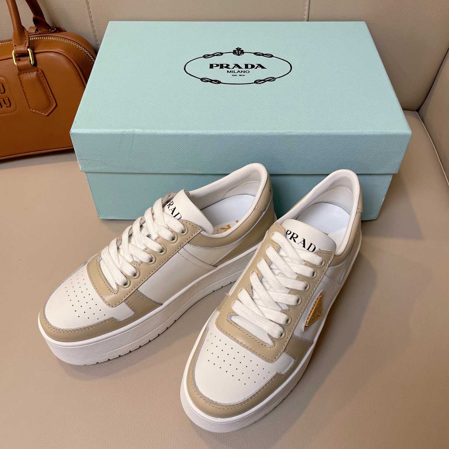 Prada Downtown Bold Leather Sneakers - FashionPlug