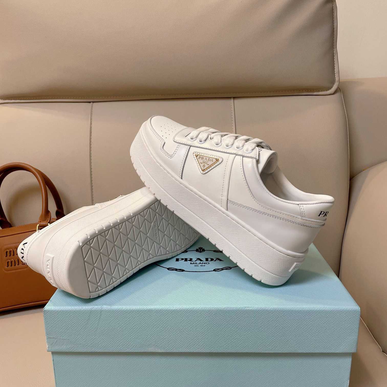 Prada Downtown Bold Leather Sneakers - FashionPlug