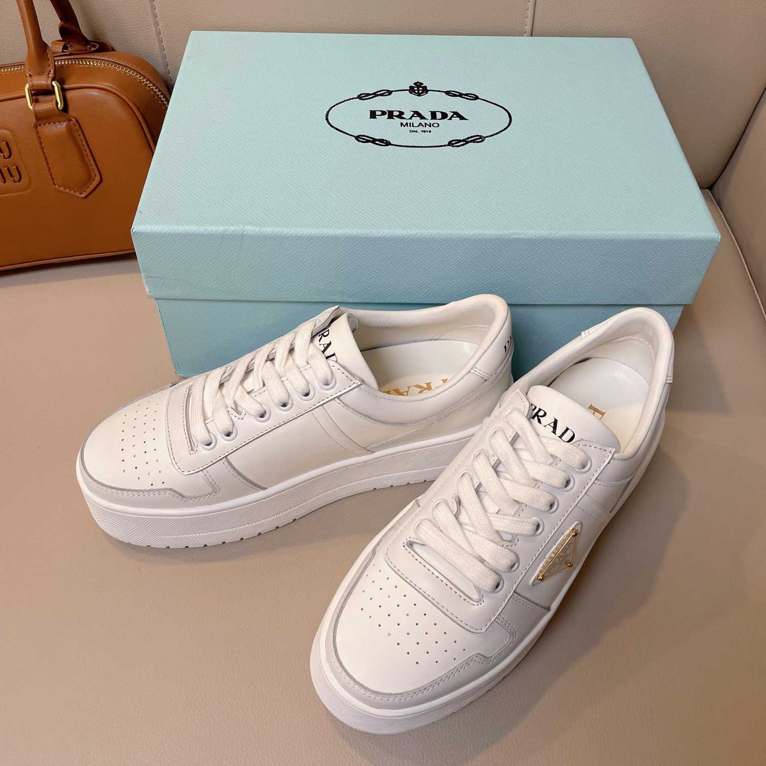 Prada Downtown Bold Leather Sneakers - FashionPlug