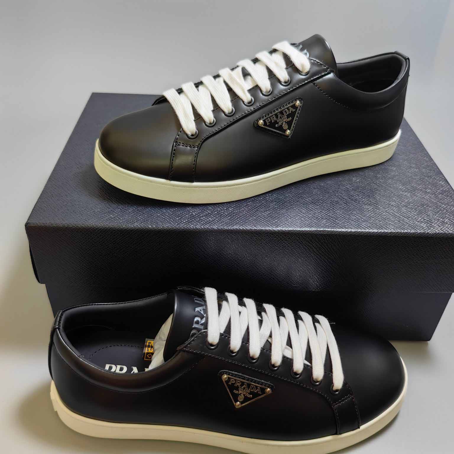 Prada Brushed Sneakers - FashionPlug