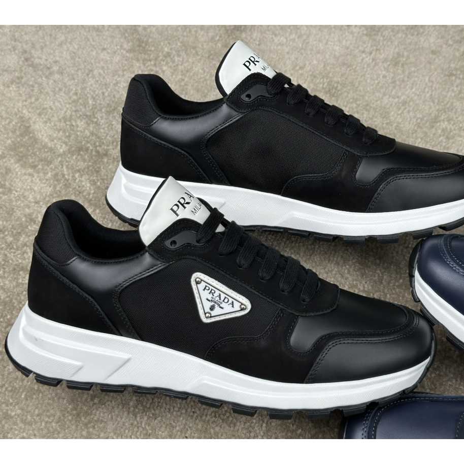 Prada Leather And Re-Nylon Sneakers - FashionPlug