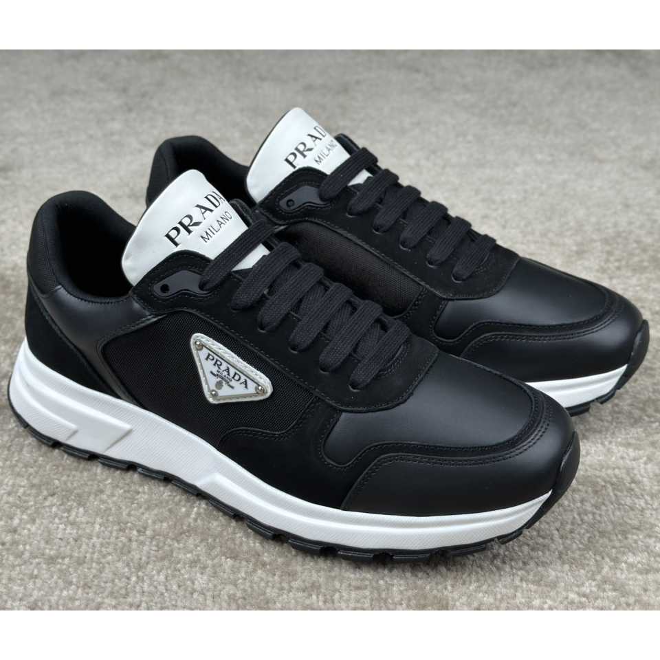 Prada Leather And Re-Nylon Sneakers - FashionPlug