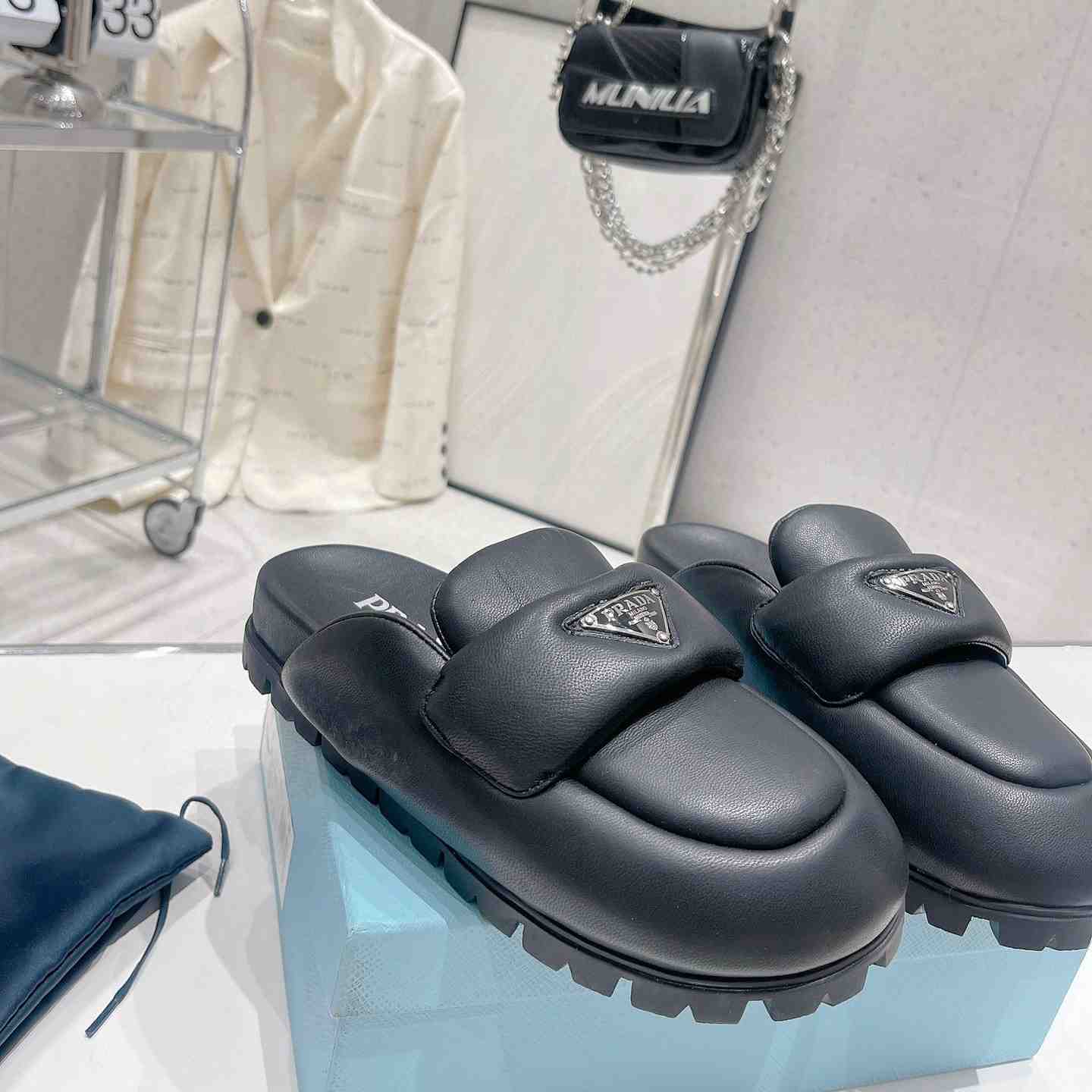 Prada Soft Padded Nappa Leather Sabots - FashionPlug