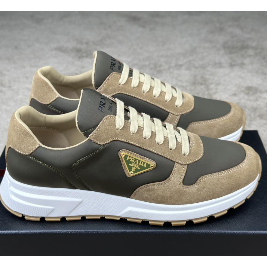 Prada Leather And Re-Nylon Sneakers - FashionPlug