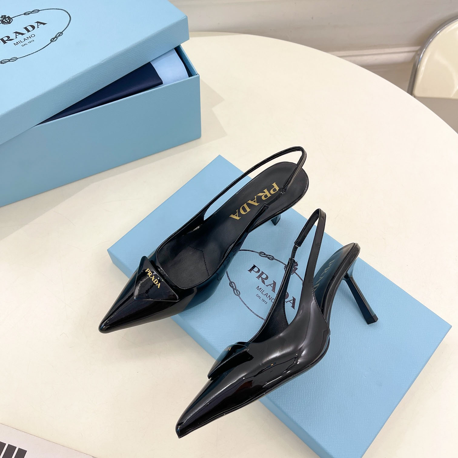 Prada 75m Patent Leather Slingback Pumps - FashionPlug