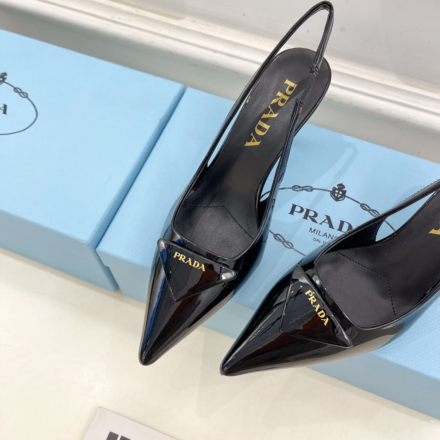 Prada 75m Patent Leather Slingback Pumps - FashionPlug