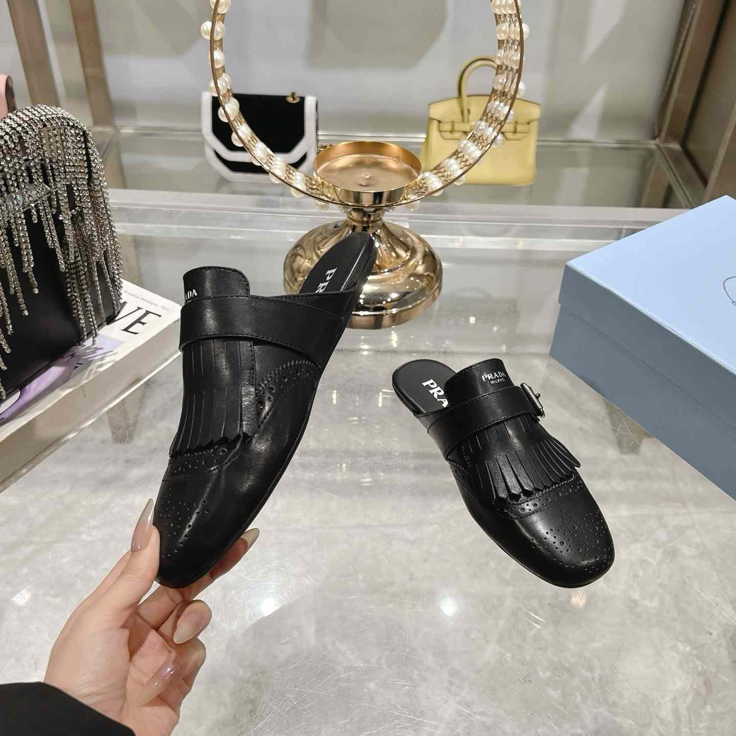 Prada Shuffle Fringed Monk Strap Leather Mules - FashionPlug